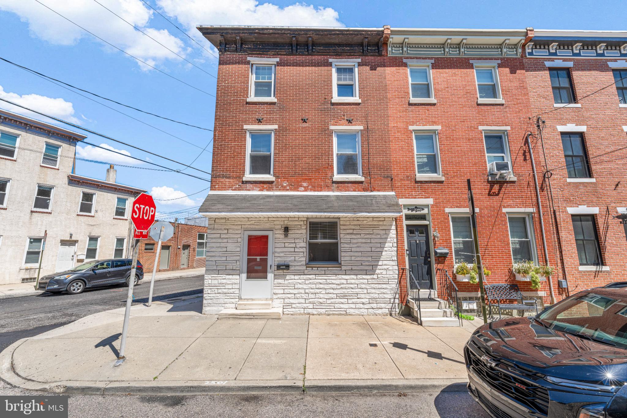 Welcome to 2501 E. Norris Street – a bright and beautifully updated corner home in the heart of Fishtown. This sun-filled property offers 3 spacious bedrooms, an updated full bath, and a newly installed roof (2024) with a transferable warranty. The first floor features open-concept living and dining areas, hardwood floors, and a modern kitchen with granite countertops, white cabinetry, stainless steel appliances, and a cozy coffee nook. Step outside to a fenced backyard patio – perfect for entertaining or gardening. Upstairs, you’ll find a large primary bedroom with exposed brick, two additional bedrooms with great natural light, and a stylish tiled bathroom. The unfinished basement offers laundry, a half bath, and ample storage potential. Located just steps from ReAnimator Coffee, Loco Pez, and Cedar Point, and within easy reach of I-95 and Frankford Ave dining. Plus, enjoy the privacy of a corner lot with only one attached neighbor.
