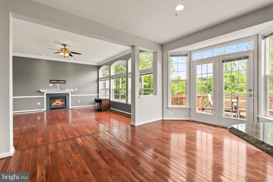 Welcome to 12310 Houndwood Way, a beautifully maintained and expansive 5BR/4.5BA single-family home in the heart of Bowie. This elegant rental features a main-level primary suite with walk-in closet and private bath, gourmet kitchen with granite counters, stainless steel appliances, and large center island. Formal living rooms offer space for entertainment, while the open-concept family room includes a gas fireplace and access to the rear deck. Hardwood floors run throughout the main level. A sunlit breakfast nook overlooks the large, fenced backyard and elevated deck—ideal for morning coffee or evening gatherings. The partially finished basement provides flexible space for a home gym, theater, or guest suite. Additional highlights include a laundry room with washer/dryer, 2-car garage, and ample driveway parking. Quiet community with easy access to shopping, parks, and commuter routes.