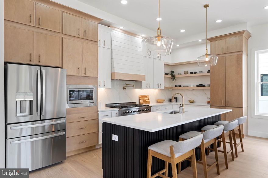 STUNNING NEW CONSTRUCTION IN REHOBOTH BEACH EAST OF ROUTE ONE!    
 
Welcome to 19704 Dunbar Street, a carefully designed, custom-built home by an award winning builder.  This 6BR/5.5BA contemporary beach-chic home is within walking distance of downtown Rehoboth Beach.  This unique property boasts plenty of room for the whole family with multiple living areas, an in-ground pool and rooftop deck.  Perfect for entertaining or simply enjoying the coastal lifestyle, this 3-story home has everything one could need.  Situated east of Route One, this home is walkable to downtown Rehoboth Beach and has easy access to award winning restaurants, tax free outlet shopping, the Junction Breakwater bike trail, and state parks. The area is ideal for year round living, beach goers and outdoor enthusiasts. The front of the house features beautiful landscaping and a paver driveway, with a double-door entryway, with custom stone and oak finishes. The first floor features include an open floor plan with 11-foot ceilings, scores of windows for natural light, hardwood flooring, gas fireplace, and a chef's dream gourmet kitchen with quartz countertops, 48" gas range, stainless steel GE Profile appliances and large island with seating.  There is a main level primary bedroom with en suite bathroom, custom tile work, high end finishes, and curbless rainfall shower with linear drains.  Rounding out the first floor there is a walk-in pantry with custom cabinetry, laundry room, an office, a mud room, a powder room, a wet bar, dining area, tankless hot water heater and a screened porch with extra storage closets beneath it.  Step outside to enjoy the outdoor living spaces. The screened porch is perfect for al fresco dining or just lounge in the sun by your private heated pool surrounded by beautiful Travertine stone.  The second floor staircase features cable railings, and there are stacked closets that can easily be converted into an elevator shaft in the future.  The second floor opens to a spacious living area with 10-foot ceilings, and features engineered hardwood floors throughout.  There are four bedrooms on this level, with two of the bedrooms having en suite bathrooms with custom tile, curbless showers with linear drains, high end finishes, and walk-in closets.  Completing the second floor there are two more bedrooms and a hall bathroom, a second level large laundry center with custom cabinetry, and additional closet space for storage.  But, that's not all!  The third floor bonus space opens into a spacious loft featuring vaulted 13-foot ceilings and a large entertainment area, a sixth bedroom, a hall bathroom, additional closets for storage, and a spacious rooftop deck with picturesque views and scenery.  Don't miss out on the opportunity to own this contemporary masterpiece in Rehoboth Beach.  Schedule your showing today and experience coastal living at its finest.  Please check out our virtual matterport tour here:  https://my.matterport.com/show/?m=pLiXosxRsAC