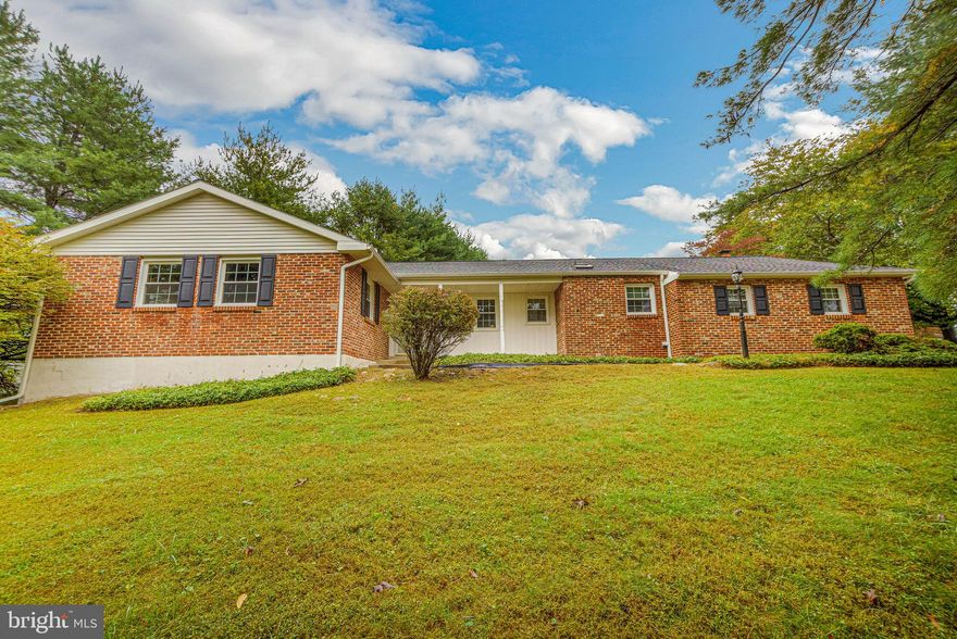 Welcome Home!! Come see this lovely 3 bedroom, 2 1/2 bath brick ranch home in the community of Langstoon. Centrally located in Marple township with access to schools, shopping & highways. This home sits on a nice lot with mature trees. As  you approach the front door you notice the size  of the home. Ceramic tiled center hall leads to a large living room with lots of natural light.  Formal dining room leads to an eat-in kitchen with an island.  The family room is off the kitchen and has a brick, gas fireplace.  The sunroom is  bright and has 2 sliders. One leads to the driveway and the other has access to a flagstone patio.  There is a powder room and laundry located behind the 2 car attached garage. At the other end of this home is the primary bedroom with 2 large closets and a newly remodeled full bath. There are 2 additional bedrooms and a full hall bath. The lower level has a finished game room with a pool  table and an unfinished side for any & all of your storage needs. The home is heated by propane and is very efficient. Recent upgrades are:  windows, roof,  insulation in attic. Showings begin on Wednesday October 5, 2022.
