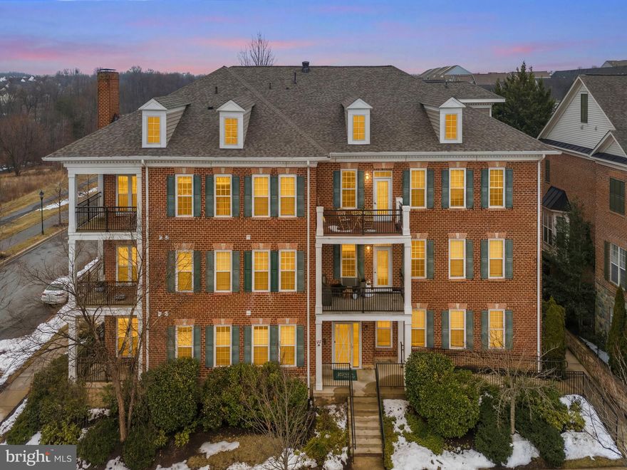 Welcome to this charming brick 2-bedroom, 2-bath condo in the highly sought-after Clarksburg Town Center!
This beautifully maintained home offers nearly 1,300 square feet of bright, comfortable living space filled with thoughtful upgrades throughout. From elegant crown molding and chair rail detailing to custom paint, updated flooring (2025), and brand new water heater (2025), every detail has been carefully curated.

The spacious gourmet kitchen features rich 42” cabinetry, granite countertops, stylish stainless steel appliances, gas cooking, a large single-basin sink, built-in microwave, and a peninsula with seating—perfect for casual dining or entertaining. The open-concept living and dining areas are filled with natural light and lead to a private balcony with peaceful views.

Both bedrooms are generously sized, including a spacious primary suite with a walk-in closet and private bath. Additional highlights include a full-size laundry room with washer and dryer, ample storage throughout.

Enjoy tons of parking and an unbeatable location just minutes from community amenities, Clarksburg Premium Outlets, restaurants, parks, commuter routes including I-270, and more.

This one truly has it all—style, space, and location. A must-see!