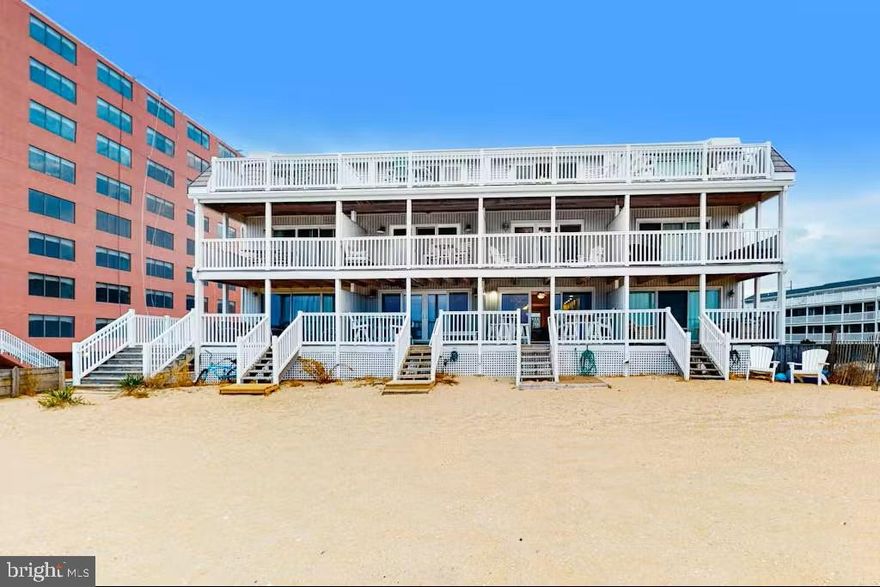 Rarely available oceanfront property with direct beach access, offering 4 bedrooms and 2.5 bathrooms in an exceptional coastal setting. Step from one of three oceanfront decks directly onto the sand, enjoy your morning coffee as the sun rises over the ocean, or unwind by the community pool—this is effortless beachfront living at its finest. Ideally located in the heart of Ocean City, just a short walk to dining, shopping, and local attractions.

The home has been thoughtfully updated throughout, featuring a fully renovated kitchen and bathrooms, upgraded electrical systems, a refreshed outdoor shower, and fully replaced exterior decking, including the beachfront stairs.

Offered beautifully furnished, this property conveys turn-key and is ready for immediate enjoyment and income generation. With a strong rental history up to over $70,000 annually, and over $35,000 in confirmed bookings for the 2026 summer season, (which buyers must honor), it presents a compelling investment opportunity for future owners. Pre-inspected for added buyer confidence.  No special assessments currently planned (buyers to confirm).