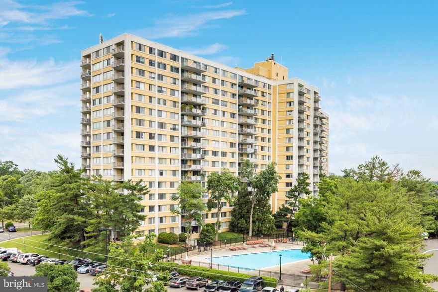 Enjoy this 1,225 square foot, 2-bedroom, 2-bath corner unit with a large balcony and spectacular panoramic views towards Washington, D.C. With south and east exposures, it boasts great natural light throughout. Garage parking is one of the many conveniences in this full-service building, which includes a swimming pool, a party room, gym, tennis courts, and a concierge front desk. Located in Alexandria, it is close to shopping and offers easy access to I-95 and I-495. ALL UTILITIES INCLUDED IN DUES.