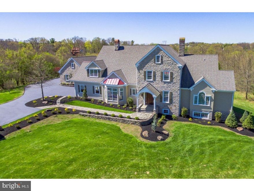 Exceptional totally updated estate situated on 7.6 acres.  This home has been completely renovated inside and out. Meander down the slate walkway to the custom solid mahogany front door. Inside you are welcomed by the soaring 2 story, foyer and living room. Features include a curved staircase, floor to ceiling stone walls and grand fireplace. Moving into the updated kitchen you will find an oversized island, brand new custom cabinets, gorgeous granite counters, tiled backsplash, new Kitchen Aid microwave built into the island, new Kitchen Aid dishwasher built-in Sub Zero refrigerator and freezer, new Kitchen Aid double wall ovens, Thermador gas cooktop with griddle, new Broan stainless steel vented range hood exhaust fan and stainless steel farmhouse sink. The kitchen is open to the breakfast area and family room. There is a butler's pantry between the kitchen and formal dining room complete with brand new cabinets, granite counter, sink, dishwasher, mini-fridge and walk-in pantry. The laundry is conveniently located on the main level as well as the home office. The owner's suite is on the main level and includes 2 walk-in closets with custom built-ins and a magnificent full bathroom with marble flooring, dual vanity with quartz counters, oversized tiled shower with frameless glass shower door, private water closet and stand-alone tub. The second level features 3 additional bedrooms each with their own full bathrooms and walk-in closets. There is a loft great for a study area or game room. The loft area has built-in desks, closets and a powder room. The full finished basement has a full bathroom and 2 large rooms with endless possibilities. There are unfinished areas for tons of storage. There is an attached 3 car garage as well as an addition oversized 2 car garage with an overhead door large enough to fit a boat, RV and other fun toys.  All bathrooms on the 1st and 2nd floors have been completely remodeled. There are 5 new HVAC units. New stucco on the exterior with a 10 yr warranty. There are too many additional details to list here contact agent for more information.(Square footage includes finished areas of the basement) Close to historical Skippack Village, walk or bike Zacharias creek trail, check out Worcester Township's website for more information on area parks and events. Perfect for Car Collectors, Horses or a family resort.  You won't want to pass this one by....come take a look!