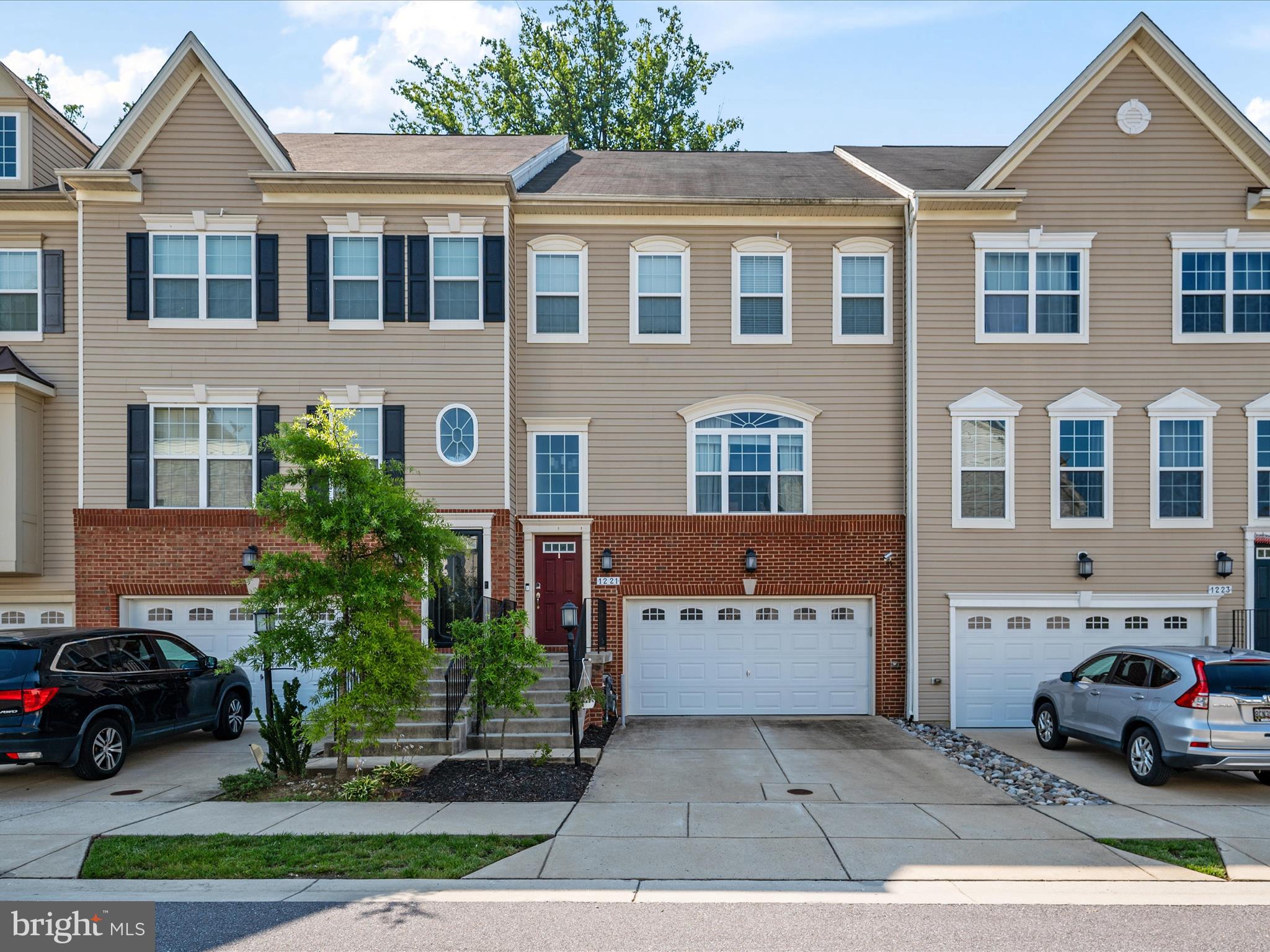 Welcome to this exquisite four-level townhome in Summerfield Village. This "Arlington" model, the largest elevation available and 1 of only 12 in the neighborhood like it, has approximately 3,600 square feet of meticulously designed living space. It offers three generous bedrooms and three full and two half baths.
The open-concept gourmet kitchen is a chef's dream, featuring stainless steel Electrolux appliances, a large center island, and a stove vent. Entertain with ease thanks to the LeGrande in-ceiling sound system on each floor and a five-speaker surround sound system in the living room, complete with a Klipsch Subwoofer and Yamaha speaker. Outlets and Ethernet ports are conveniently located on every level.
The primary suite on the 3rd floor offers a tranquil retreat with a sitting area, a luxurious dual-head shower, and a walk-in closet. Ascend to the gorgeous fourth level, a versatile space perfect for an office or music studio, complete with a half bath, wet bar with a mini-fridge, and a second green energy HVAC system for optimal airflow. Two doors lead out to the private rooftop patio, ideal for relaxation or entertaining.
The finished garage features an epoxy floor and a Lift-Master garage door opener. This home also includes a full basement with 656 finished square feet.
Community amenities abound, including two playgrounds, a dog park, and walking trails, with a clubhouse for residents to enjoy. With easy access to major commuter routes and MARC, and a walking trail just around the corner to restaurants and shops, this is a must-see property!
