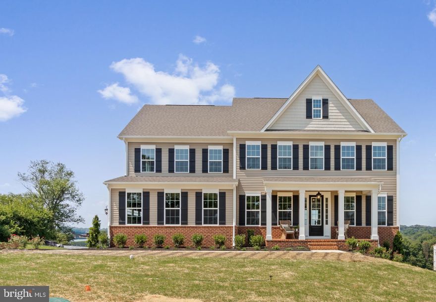 Welcome to your dream home! This stunning, fully completed new construction in Western Howard County is ready for immediate move-in. Offering everything you’ve been looking for in a single-family residence, this property features 5 spacious bedrooms and 5 beautifully designed bathrooms, making a lasting impression from the moment you step inside. The inviting foyer opens to a versatile flex space—perfect as a formal dining room or living area. The open-concept design effortlessly connects the gourmet kitchen, family room, and dining area, making it ideal for both entertaining and everyday living. In the kitchen, you’ll find 42" cushion-close cabinets, a striking designer hood vent, a massive 10' island with mitered-edge Quartz countertops, and premium GE Profile stainless steel appliances. The oversized 2-car garage connects to a convenient mudroom/arrival center, leading to a full bath and a private study or potential 5th bedroom. Upstairs, retreat to the owner's suite, featuring two generous walk-in closets and a spa-like bath with dual vanities, a soaking tub, and a walk-in frameless glass shower. Each secondary bedroom is equally impressive, complete with walk-in closets and bath access. The finished lower level offers even more living space, with a full bath, ground-level walkout, and plenty of storage. This home combines luxury, comfort, and functionality in perfect harmony!