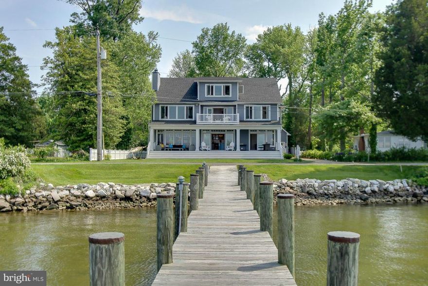 Pristine home w/sweeping water views!Custom built w/meticulous attention to details inside&out.Open floor plan w/10' ceilings, gourmet kitchen w/granite &SS, gorgeous porcelain wood tiles on LL &Cherry HW floors on UL. Luxurious master w/freestanding tub,walk-in closet,dbl sinks,&waterside balcony.Bonus 3rd floor w/full BA &storage plus extra large garage w/upstairs loft. Private pier w/2 lifts.