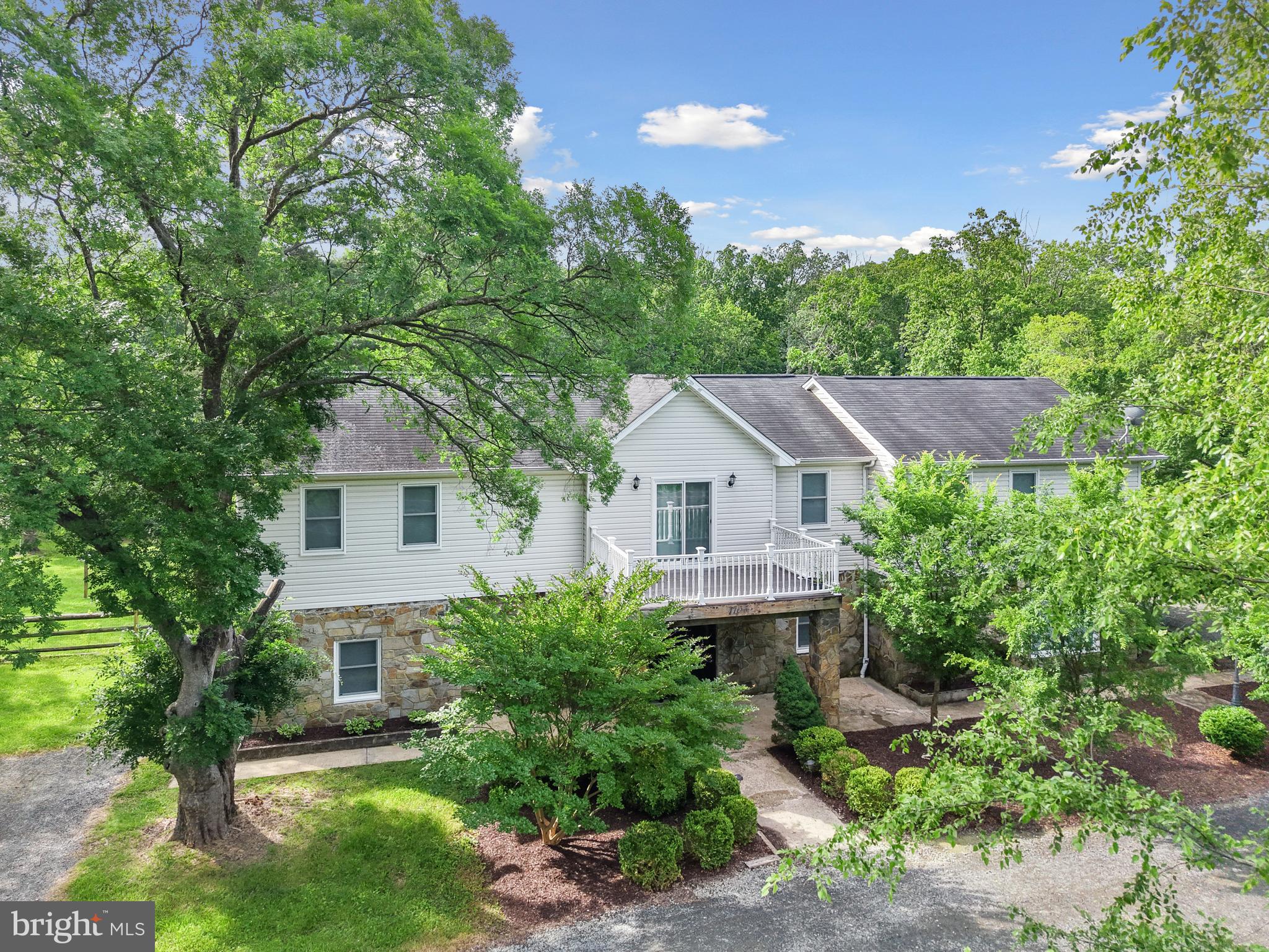 Discover this stunning home, perfectly situated on over 1.5 acres of flat land – a true rarity! Step inside to a welcoming foyer that gracefully ascends to the spacious dining area and a chef's dream: an updated gourmet kitchen. Prepare to entertain with ease, featuring a wine refrigerator, double ovens, a convenient cooktop, and an abundance of rich cabinetry. The expansive lower level is home to a huge family room, offering ample space for relaxation and gatherings, with direct access to your incredible backyard retreat. Prideful ownership shows with investments into the brand new heat pump (2025), new hot water tank (2023) and newer windows (2021). Upstairs, unwind in the large primary suite, boasting a private bathroom complete with a stand-up shower, a separate soaking tub, and an impressive walk-in closet! Three additional, generously sized bedrooms provide comfort and privacy for family and guests. One spare bedroom even includes its own private ensuite bathroom, while a well-appointed hall bathroom serves the others. A versatile loft area provides bonus living space and leads to a charming front deck, ideal for enjoying your morning coffee. The backyard is a true standout, offering approximately 1 acre of fenced space, providing both security and endless possibilities for outdoor enjoyment and recreation. Don't miss the opportunity to own this exceptional property in Bealeton!