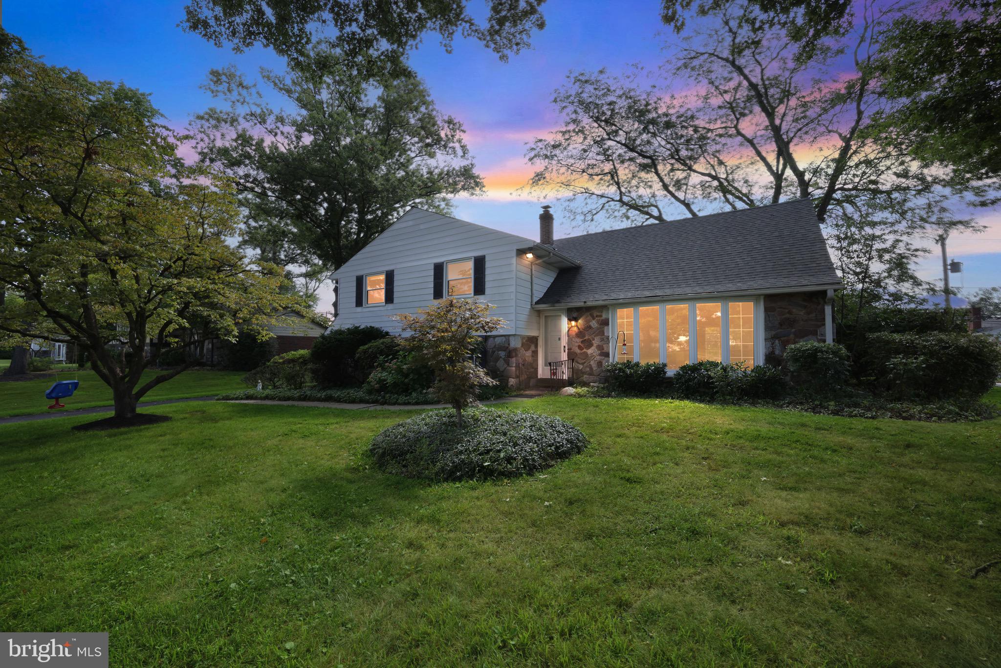 Welcome to 1861 Lippincott Road in the desirable Chapel Manor community of Huntingdon Valley. Located in the award-winning Abington School District zoned to attend highly regarded Rydal Elementary, this spacious 5-bedroom, 2.5-bath split-level is one of the largest homes in the neighborhood and ideal for growing or multi-generational families.
As you pull up, you will notice the mature foliage of the property setting the stage for peaceful days in nature, as well as plenty of family fun. A flowering dogwood tree with hanging baby swing adorns the front yard, while the basketball hoop at the end of the driveway is backed by an extra large flowering cherry tree, creating a beautiful pink backdrop during family games in the spring. Additionally, several large trees in the backyard provide plenty of shade to relax on the generously sized back deck during family gatherings or simple quiet afternoons.
Step inside to a bright foyer with large coat closet leading to an inviting living room featuring a new bow window (2022) with motorized shades. The space flows effortlessly into the formal dining room with access to the rear deck overlooking the serene, tree-lined yard. The updated kitchen (2019) features custom cabinetry, quartz countertops, and stainless-steel appliances including sub-zero refrigerator.
Upstairs, you’ll find a spacious primary suite with dual closets and private bath, plus two additional bedrooms (both with ample closet space), and good sized hall bath including a linen closet. The third level includes two more bedrooms (one currently used as an office).
The lower level offers a comfortable family room with a wet bar, a glass-front fireplace with Italian tile surround, built-in shelving, and access to the back patio. This level also includes a powder room, laundry/utility room, and entry to the oversized garage with electric opener and Tesla charger.
Recent updates include a new roof (2022), hot water heater (2019), and more. There are several areas of the home that are still in need of general updating, however, the bones of the home are solid, and with a new roof, and kitchen, already in place, by making your own personalized updates elsewhere, this home will truly become your oasis. It's prime location allows you to enjoy multiple nearby parks, trails, shopping, dining, regional rail, and septa bus service, all while still providing a peaceful suburban setting in an award winning school district to relax and call home!