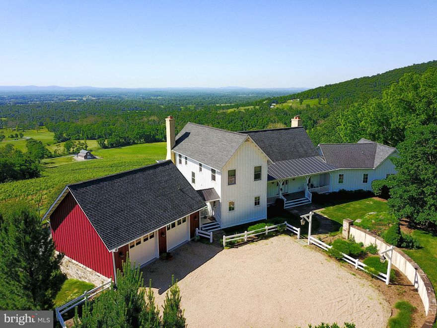 Wow!  That's the response you will have  when you walk in the door and the view unfolds before you.   The modern farmhouse is elevated above an award winning vineyard with scenic Loudoun Valley in the distance below.  Please note the Covenants, Conditions and Restrictions for the Shamrock Subdivision prohibits the retail sale of alcoholic beverages.  Completed in 2008 by builder Miller and Blackwell and designed by Barnes Vanze  Architects, every detail was carefully considered in order to achieve a casual, relaxed lifestyle.  Built  with a focus on the love of wine, a kitchen for an accomplished cook and making the most of the site's panoramic views all while being convenient to the D.C. Metro area, this home hits the mark.    The open floor plan  consists of three levels and over 4,000 square feet of finished living space, but, the home offers the ability to finish another 2,000+ square feet if a new owner is so inclined.  The 4 bedroom, 4 1/2 bath home is sited on 23 scenic acres with Ipe decks and screened porches to take advantage of the view.  The main floor is made for casual entertaining with a large great room  open to the gourmet kitchen.  The cathedral ceilings, 4 wood burning fireplaces, and materials consistent with an old Virginia Farmhouse such as ripped tobacco wood floors, a beadboard ceiling, flat-stock casing and white painted built-ins complete the feel.  The master suite is located on the main level with large dressing room/closet.  Two additional bedrooms are on the upper level, both with baths and a forth bedroom/bath is located on the lower level.  An office and recreation room is also on the lower level.  The lower level is light and bright with large windows and Atrium doors providing entry and exit to this level.  The landscape was designed by Jay Graham.  The beautiful rock garden in the front of the house is very picturesque providing color all through the year.  Specimen trees are placed about the property.  The award winning vineyard is leased until the end of the current growing season allowing a new owner the option to continue or start anew.***Amazing  Floor Plan Tour***https://tour.truplace.com/property/617/87155/***