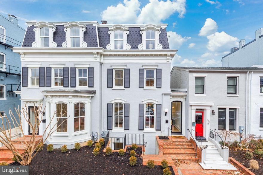 Created by Brush Arbor Home Construction's masterful collaboration of architects, interior designers, and landscape architects, this total renovation of one of Frederick Douglass' former residences is a four-level Second Empire-style townhouse of impeccable elegance and exceptional scale. Providing bespoke tranquility in a coveted location just a couple blocks from the Supreme Court, Capitol and Senate Buildings, no detail has been overlooked in the custom renovation of this architectural gem.  Here, luxury and sophistication clearly meet modern day amenities and lifestyle needs.    A spectacular open floor plan integrates 10' ceilings, elevator shaft, custom interior and exterior millwork, hand-milled white oak floors, Jeld Wen windows and doors, fixtures by Kallista and waterworks, and designer bespoke finishes such as lighting by Visual Comfort; all provide breadth and airiness on the main level. There is a seamless flow from indoors to outdoors from a custom 15-foot wall of retractable doors opens to the rear patio and garden, capturing an abundance of natural light adjacent to the chef's kitchen with its rigorously curated appliance package.    The well-appointed primary bedroom is on the third level, with spa-inspired bathroom, walk-in closets, large sitting room with wet bar and private roof terrace. All five secondary bedrooms, spread across the second level and the lower level echo the primary's luxury finishes and closet space. The exceptionally crafted lower level's family room with built-ins, bonus bedrooms and access to the garden from the lower level provide excellent flexibility for au-pair or in-law living configurations. The exterior has been planned with the utmost discernment, executed to provide a private backyard retreat which features a stone patio, shaded by strategically chosen, well-placed greenery, with both a single car and a 2-car garage (totaling three parking spaces)..