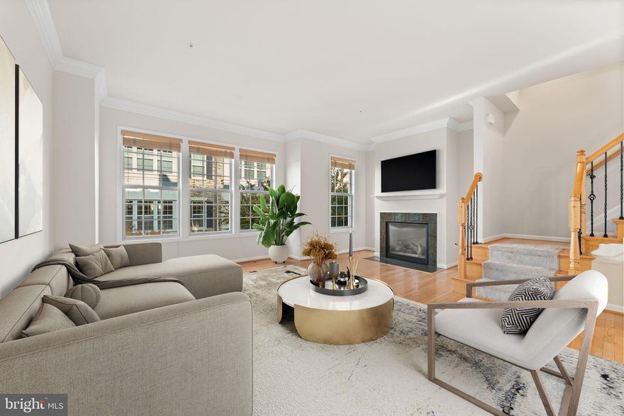 Discover refined living at 602 Overlook Park Drive, a sophisticated 4-level luxury townhome nestled within National Harbor’s prestigious gated community. This immaculate residence blends elegance, comfort, and elevated design with 3 bedrooms, 3 full baths, 2 half baths, and a 2-car garage with additional 2-car driveway, offering an exceptional living experience just minutes from the water’s edge.

Graced with 9-foot ceilings and flooded with natural light, this home boasts exquisite hardwood floors, new carpet, and seamless indoor–outdoor living—perfect for both intimate everyday living and memorable entertaining.

The Entry level flex space is ideal as a home office, den, fitness room, or guest lounge with a half bath and two closets.  Enter from the front door or the garage with ease.

Main Living Level
An open and airy layout sets the stage for luxury living. The spacious living and dining areas feature rich hardwood flooring, a cozy gas fireplace, and an effortless flow into the gourmet kitchen. Designed for the inspired chef, the kitchen showcases stainless steel appliances, double wall ovens, gas cooking,  an abundance of refined cabinetry, a charming breakfast nook—ideal for morning coffee or evening wine.

The elegant Owner’s Suite offers a luxurious sanctuary with space for a king-sized bed set.  Custom-built walk-in closet, and a spa-inspired en-suite bath featuring dual sinks, upgraded cabinetry, and an oversized linen closet. A second bedroom with a private full bath and walk-in closet provides comfort for family or guests. The laundry room on the bedroom level adds everyday convenience.

Entertainer’s Top Level – A Showpiece
Third bedroom with a full bath on this level enhances comfort for guests.
The 4th level loft transforms into an elevated entertaining oasis, complete with a wet bar with sink, wine refrigerator, and a second stainless-steel dishwasher. Step onto the private terrace and indulge in breathtaking views of the Potomac River and the Woodrow Wilson Bridge—an unforgettable setting for sunset cocktails, weekend gatherings, fireworks, or quiet evenings under the stars. 

Additional Highlights & Lifestyle Amenities
• Freshly painted interior with premium finishes and new carpet.
• Community courtyard retreat with stone-facing fire pit and seating
• Two dog parks within the community
• Prime location minutes to DC, Old Town Alexandria, Reagan National Airport, MGM, Tanger Outlets, the Gaylord Convention Center, and waterfront attractions including the Capital Wheel.
• Close proximity to Joint Base Andrews , Joint Base Anacostia-Bolling and National Airport

This exceptional residence offers a rare blend of luxury, tranquility, and urban convenience—perfect for discerning buyers seeking a refined National Harbor lifestyle in a secure, amenity-rich community.