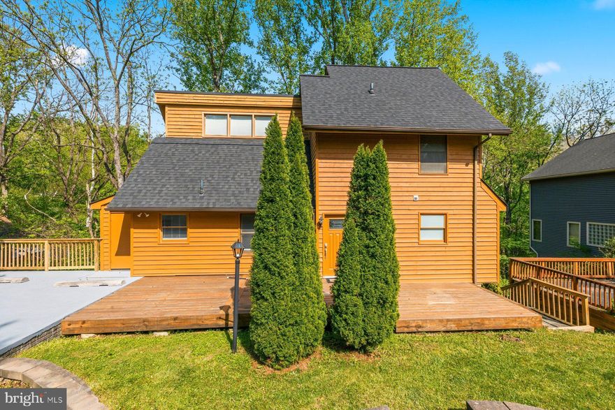 Stop looking! The perfect single family home in Lake Linganore is now available. Backing to woods and common trails, you can't get more peaceful than this. And with the multiple level deck, access to the beauty of Lake Linganore is at your fingers. Just blocks from both Lake Linganore and Lake Merle, the location can't be beat. Once you step inside, you'll notice the careful care the owners have taken and the nice upgrades throughout the home. As you step in, you enter the large dining area right off the kitchen and family room, making it easy to entertain family and friends. The kitchen is nicely updated with quartz counters, white cabinets, a large single sink, and stainless steel appliances. And the pass through window to the family room is so clever! The family room with cathedral ceilings is so cozy - and opening to the top deck, offers the perfect spot to unwind. And if you've been looking for a main floor primary, this is it!  Boasting hardwood floors, its own opening to the deck, a large walk-in-closet, and an updated bathroom, this primary suite is divine. The bathroom is gorgeous - with dual vanities and a large walk-in shower with subway tiles.  Upstairs, you'll find 2 generous sized bedrooms and a full bath. The window unit in bedroom 3 is to accommodate a very cold bedroom for sleeping and this is a cost saving so that the entire house does not need to be cooled to the same temperature. Downstairs, the potential is endless. With a rough-in for a half bath, this could be the perfect rec room or in-law suite. There is access to the lower level deck leading out to the creek and woods. Egress windows and a wet bar that has been started leave just your finishing touch to make it your own! Enjoy all that Lake Linganore has to offer: deep Navigable lake, multiple sandy beaches, multiple pools, boating, fishing, swimming, tennis, basketball, beach volleyball, nature & bike trails, Frisbee golf, pickleball, Event Tent, Farmers Markets, Summer Concert Series under the stars, playgrounds and so much more! Come and see for yourself. HOA fees include snow removal and trash/recycling as well as access to all of the amazing amenities!