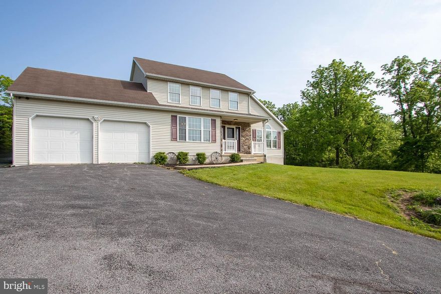 Enjoy panoramic views from this 4 bedroom, 3.5 bath home in Bellefonte School District! This stately 2-story delivers multiple living spaces, seclusion, and passive income potential in the fully finished lower level. You will appreciate the welcoming front porch and impressive foyer leading you to a light + bright living room with vaulted ceilings and ample natural light. A sprawling dining room guides you to a well-equipped, white kitchen with stainless steel appliances and a built-in coffee bar. The primary bedroom boasts a vaulted ceiling, private balcony, and a full bathroom with dual vanity and shower tub. Two generously sized bedrooms and another full bathroom round out the 2nd floor. Retreat to the fully finished, walkout basement where you will find a cozy family room, kitchenette, large bedroom, and another full bathroom. Laundry hookups can be found in the unfinished area. Additional highlights include an attached, 2-car garage, forced air, shed, deck, and a covered porch overlooking the neighboring mountain ranges. Conveniently located 15 minutes to Bellefonte, and 25 minutes to downtown State College and Lock Haven, with easy access to I-80 and I-99.