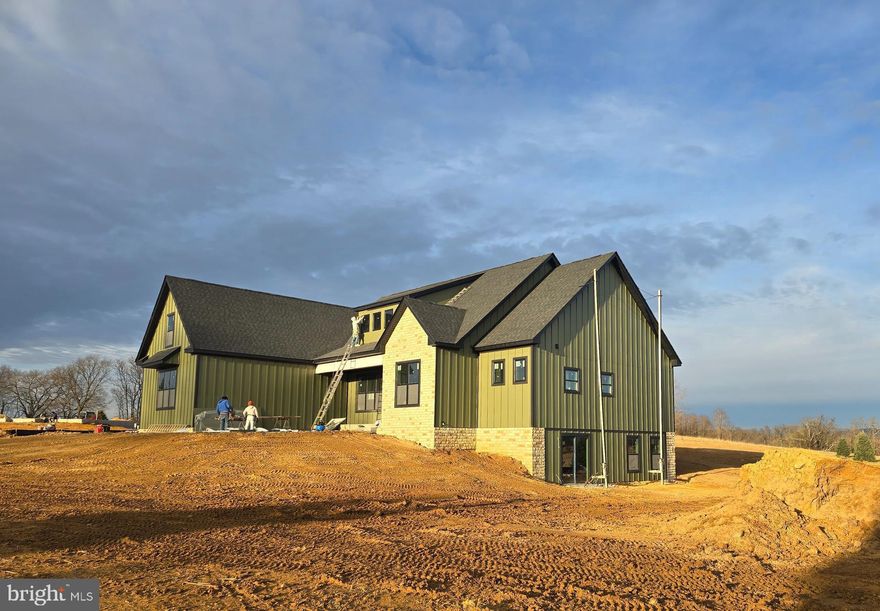 Delivery date 2/2/2026! This home will have Sage Green Hardiboard siding.  Enjoy the best of both worlds — peaceful country living with convenient access to everything you need. 

This new 2 +/- acre homesite is located in a new community that incorporates a desirable location and country feel!

Your new home will be a beautifully built 4-bedroom, 4.5-bath Farmhouse ranch-style, designed with comfort and quality in mind. The open floor plan features vaulted ceilings, luxury vinyl plank flooring, solid surface countertops, and soft-close cabinets. The kitchen comes with a full appliance package—already upgraded—so you're ready to cook and entertain from day one.

There's a full partially finished basement for storage, hobbies, or future living space. The home is thoughtfully laid out for easy, one-level living, with a finish upper level bedroom and full bath with plenty of space for guests or quiet relaxation.

Outside, you’ll have room to enjoy — ideal for gardening, outdoor gatherings, or just soaking in the peaceful surroundings.  And while it feels like you're out in the country, you’re just minutes from local parks, schools, shopping, and other amenities.

Come settle in a place that offers comfort, space, and a true sense of home.

Some photos shown are of a similar home previously built. This home is scheduled for March 2026 delivery, giving you time to plan and prepare for your next chapter.

Price includes up to 1200 finished square feet with full bath in the basement.