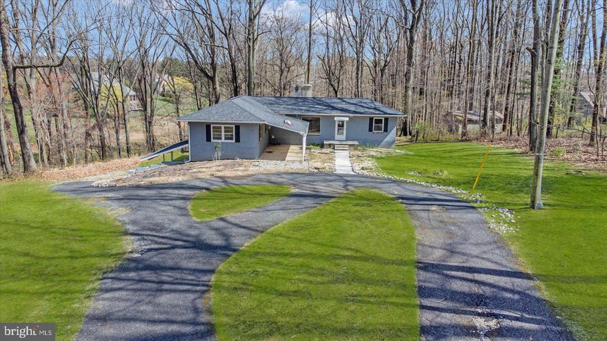 INVESTMENT OPPORTUNITY!! No builder tie in! Welcome to a rare opportunity in the highly sought-after Falls Road corridor. Set at the end of a long private driveway, this expansive and secluded 4.15 acre (+/-) offers an existing structure & picturesque setting for your dream home build. 

The seller has done all the homework!! A Baltimore County variance has already been APPROVED allowing for the construction of a 4900 sq ft (+/-) custom home. Create a residence that truly reflects your vision and lifestyle. Architectural and structural engineering plans are completed and available. Just B.Y.O.B. (Bring Your Own Builder)! IMAGINE THE RETURN ON INVESTMENT!

Alternatively, you can choose to reimagine the existing structure, harnessing its potential to craft a unique living space.
Appreciate the convenience of the Falls Road corridor location, with its easy access to amenities, schools, and major transportation routes.
Buyer to verify all permits needed to bring your vision to life. Don't miss this incredible opportunity to build the home you've always dreamed of in one of the most coveted locations in the area. Schedule your showing today!
***House image is rendered drawing of what home could be **** House Sold As Is