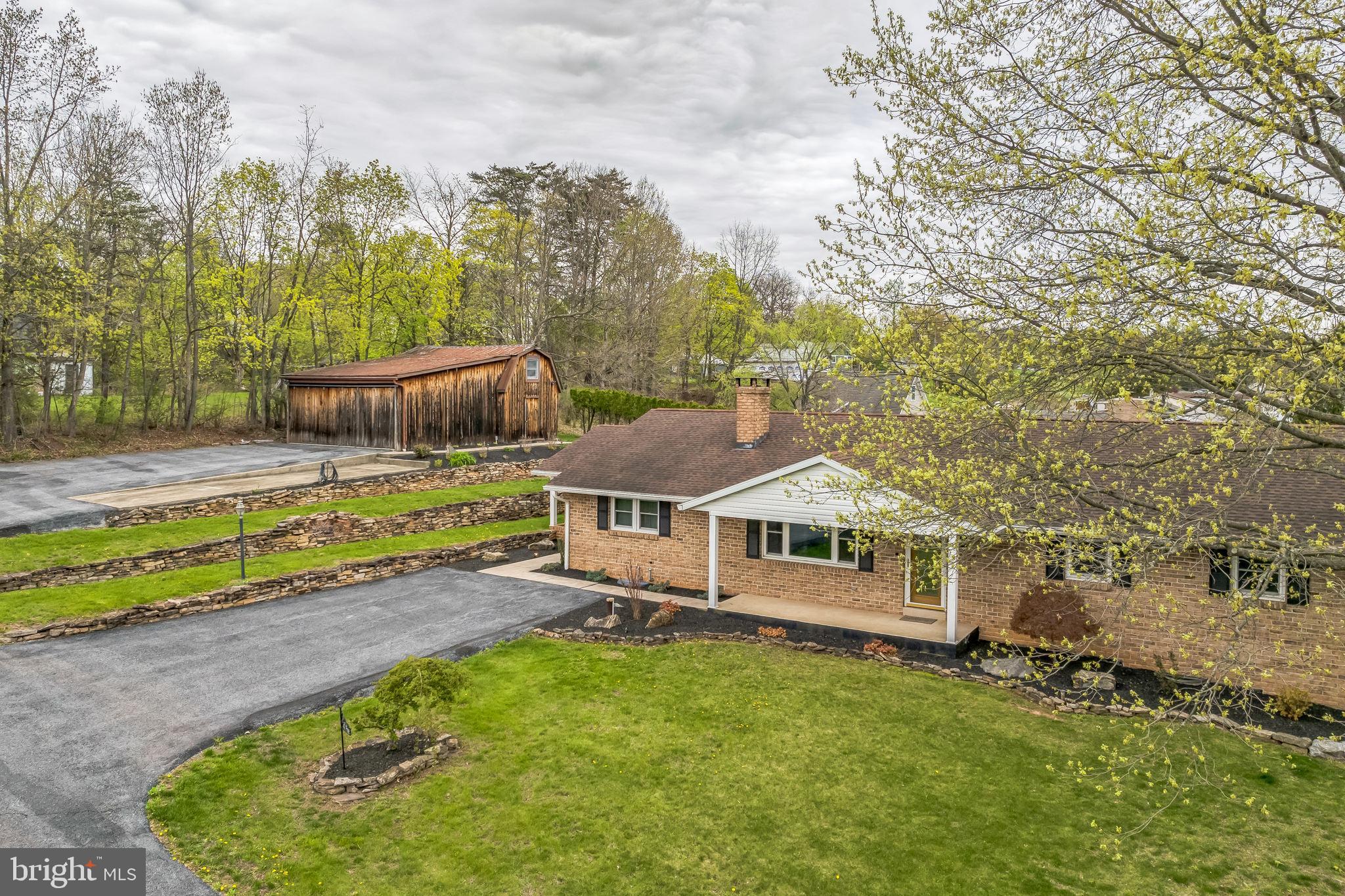 ***We have received an offer. Seller is asking for all offers to be submitted by noon on Monday, April 28th***47 Pine Avenue is a dream come true! Get ready to own your own piece of paradise. This 4 bedroom raised ranch, on a quiet street, has been updated with beautiful finishing touches, modern conveniences and fun for all! Enter through the front porch, into the large living room featuring a gorgeous stone fireplace with granite hearth and engineered hardwood floors. The living room opens to the amazing eat-in kitchen. There is a large island for eating/entertaining with a granite countertop, beautiful glass tile backsplash, modern lighting fixtures, stainless steel appliances and plenty of cabinet space. Off of the kitchen is a formal dining room with wainscoting, elaborate crown molding and 2 storage closets. Down the hall you will find the large owner's suite with double closets with bi-fold barn doors, an updated en suite bathroom with lovely, walk-in tile shower and modern vanity. The owner's suite also has private access through sliding glass doors to a deck. The main floor also hosts 3 additional nicely-sized and updated bedrooms, one of which is currently being used as a massive, dream closet and dressing area with plenty of storage for clothes/shoes and it also has a granite topped dresser and fabulous chandelier. The hall bath has a shower/tub combination , large vanity sink and plenty of storage. Down the stairs you will find a generously sized, carpeted family room and a separate room that would be a perfect office, craft room or 5th bedroom. The lower level also has a full laundry room, 1/2 bath and a massive attached garage that could easily park 3-4 cars and has a huge area for a work shop and/or exercise area. Outside is just as impressive! The side entrance has a large, covered concrete patio for relaxing and grilling. There are glass sliders off of the kitchen that lead to an amazing entertaining area with composite deck, covered area with lights and dual ceiling fans, a beautiful/refreshing/amazing inground pool and a separate hot tub! You will never want to leave! The property also has a separate barn, with room for 2 cars to park inside, a loft and storage area. Bring your creative ideas to transform the space into a massive entertainment area, car enthusiasts dream space or the ultimate play area. Parking for your guests will never be a problem as the house has 3 driveways and a separate parking pad for your trailer or boat. Showings start Friday, April 25th, so get on the schedule to see this amazing property now!
