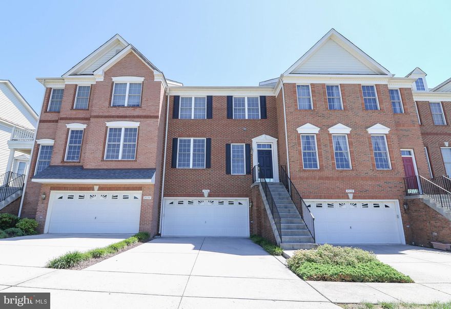Brick front, two car garage luxury town home. Freshly painted throughout in 2019. New carpet throughout in 2019. Hardwood foyer entry. Open Living Room and Dining Room with crown moulding and chair railing. Updated Kitchen with Breakfast Nook features granite counters, stainless steel appliance and new back-splash. Family Room with cozy gas fireplace. Master Bedroom with walk in closet and En Suite Owner's bath boasting a soaking tub and seamless glass shower. Secondary Bedrooms with vaulted ceilings. Upper level laundry room. Finished, walk-out lower level with powder room. Close to shopping and amenities. Faulous commuter location.