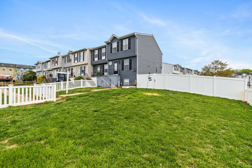 Welcome home to this beautiful end-of-group townhome nestled in the community of Carroll Wood Manor. This home offers three bedrooms, two and a half baths, and a fully finished basement that provides additional living space, a home office ,or even a gym. Step inside to a traditional layout with a combined kitchen and dining area, complete with a cozy, well-appointed kitchen, and access to a rear deck—perfect for outdoor gatherings. Enjoy luxury vinyl plank flooring on the main level, plush carpeting upstairs, as well as upper level laundry for convenience. Step outside to a truly unique, generously fenced-in yard  that offers endless possibilities for outdoor living. This expansive space is perfect for entertaining guests, hosting barbecues, or simply relaxing in your own private retreat. Additional highlights include walk-in closets, a backyard shed for extra storage, a walk in shower, and a beautifully maintained neighborhood. Conveniently located near shopping, dining, and the water! This wont last long!