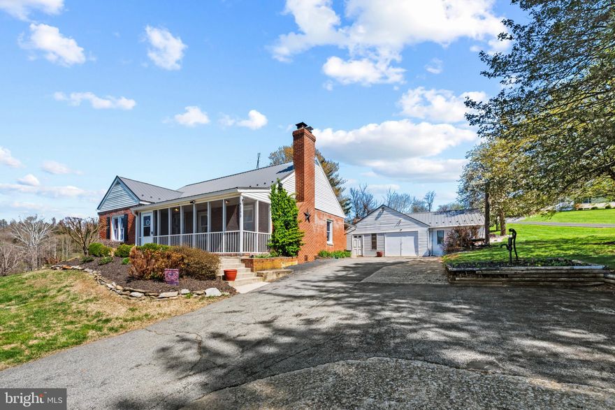 NEW PRICE! OPEN HOUSE SUNDAY 4/26 - 1:00-3:00! Welcome to 9233 Baltimore National Pike in Middletown—where country charm meets everyday convenience. This well-maintained 3 bed, 2 full bath home offers over 2,100 finished square feet, including a mostly finished lower level that provides flexible space for a family room, home office, and bonus room. Upstairs, you’ll find a blend of hardwood and luxury vinyl plank flooring, creating a warm and durable living environment. The home is equipped for year-round comfort with a 2016 forced air heat pump, baseboard backup oil heat, and a cozy wood stove—giving you multiple climate control options to suit your needs. Step outside and enjoy the peaceful setting from the screened-in front porch, or entertain in the spacious backyard featuring a patio and storage shed. The oversized 732 sq ft detached garage easily accommodates a vehicle with additional room for storage or a workshop, while the large driveway offers ample parking for guests. RECENT UPDATES: include a 2020 tin roof on both the main house and garage, a 2022 water heater, plus a UV filtration system and water softener for added peace of mind. Appliances have been updated between 2025–2026, making this home move-in ready, budget-friendly to get into Middletown!

Located in the desirable Middletown school district, this property offers the best of both worlds—quiet country living with easy access to commuter routes and all the conveniences of nearby town amenities.

Don’t miss your opportunity to enjoy space, versatility, and comfort in a beautiful Frederick County setting.