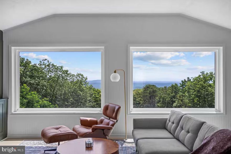 Wake up to breathtaking views of the Shenandoah Valley every day in this peaceful, beautifully renovated cottage. Completely updated in 2024, the home blends modern amenities with warm, inviting charm.
The bright, open living space features a vaulted ceiling and abundant natural light, creating an airy, welcoming atmosphere. The living room showcases large windows, custom built-ins, and a stone fireplace, flowing seamlessly into the stylish kitchen. The kitchen is designed for both beauty and function with quartz countertops, stainless steel appliances, a tile backsplash, decorative hood vent, and open shelving.
The bathroom has also been thoughtfully renovated with a full glass shower, updated vanity, and elegant stone surround.
The property includes an impressive 2,500-square-foot shop that is heated and cooled, with its own separately metered 200-amp service—perfect for car enthusiasts, hobbies, workshop space, or storage. A unique mural on the shop was created by a local artist, adding character and charm.
Set on three private acres, the property offers space to relax, play, hike, and explore while enjoying the surrounding natural beauty.
Conveniently located just a short drive from many of the region’s most sought-after destinations, including Washington, DC, the Shenandoah National Park entrance, breweries, wineries, rivers, and lakes.
Additional updates include the septic system,  roof, water softener,  well pump & water heater making it a very energy efficient home. 
Escape the hustle and bustle of the suburbs and discover life on the mountain!