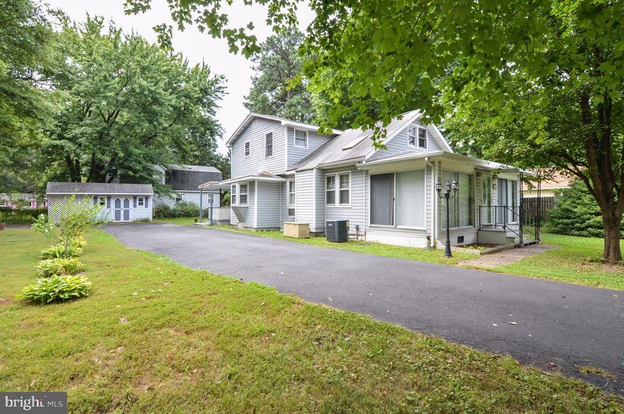 Great price for 4 bedroom/2 bath home on a beautiful .29 acre property close to the Potomac River.  Rehab potential with lots of positives including house generator, gas stove & fireplace, heat pump on first floor & heated glass enclosed porch.   Covered deck, fish pond, 2 sheds, paved driveway & lots of land. Golf cart access to town amenities. 1.5 hr to DC & Richmond.  Sold AS IS.