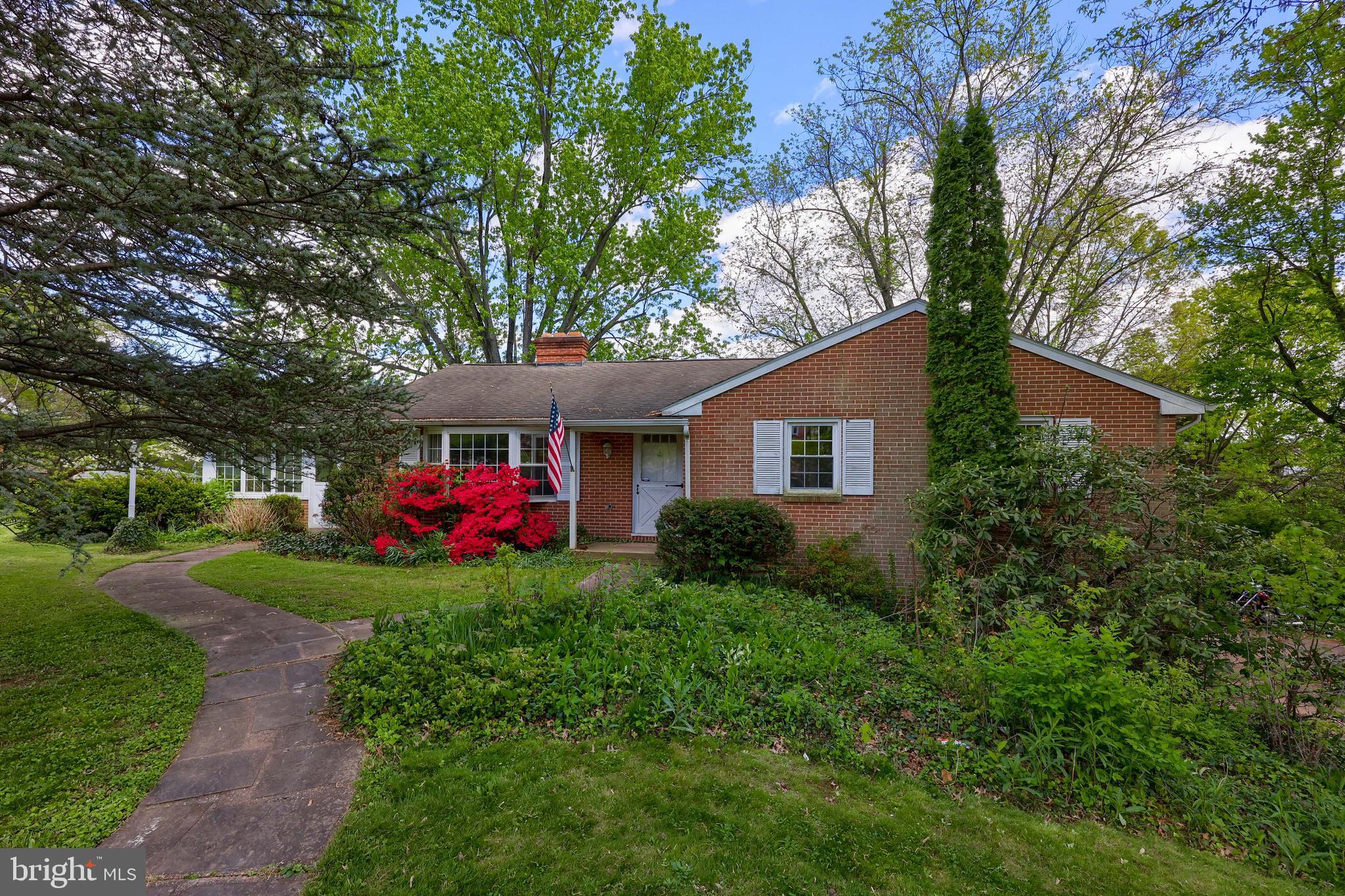 All brick home situated on nearly an acre. Bring your tools and your vision to make this home sparkle! Featuring a bright and open layout with an expansive sun room that access steps to the rear patio, and hardwood flooring throughout the main level. The first floor includes three spacious bedrooms with hardwood flooring and a full bath. The living room offers a wood burning fireplace - perfect for cozying up to on those cooler evenings, and a bay window for natural lighting. A formal dining room can be located directly off of the spacious eat-in kitchen. The lower level is ideal for extra living space. A family room offers a floor-to-ceiling fireplace and the rec room includes a bar area. Bring your tools and equipment to utilize the workshop area. A laundry room, full bath, and bonus room complete the lower level. The exterior offers a rear patio with a private tree lined backyard. Oversized two car garage with man door. Easy commute to I-83 & Route 30. Convenient to schools, parks, restaurants, shopping, and other local amenities.