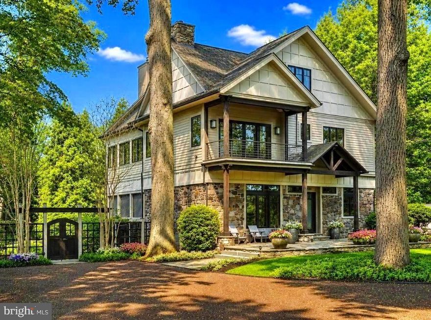 Introducing River Soleil - a magnificent riverfront estate where architectural character, remarkable privacy, and walkable access to downtown New Hope converge into a truly one of a kind offering. Originally a fisherman’s cottage, the property has been transformed into a striking compound that blends warmth, history, and elevated modern design. Framed by towering trees and introduced by a striking timber truss entrance, this extraordinary estate feels worlds away while remaining just moments from the boutiques, acclaimed restaurants, galleries, and charming river towns that define this coveted stretch of Bucks County. Stroll into downtown New Hope, cross the bridge to Lambertville, or explore the nearby destinations of Lumberville, Stockton, and Frenchtown before returning to a private retreat complete with direct river access, a private dock, tiered seating overlooking the shoreline, and immediate access to the scenic canal towpath. A circular driveway and bluestone patio arrival leads into interiors layered with rich materials and custom craftsmanship. Brazilian cherry flooring extends throughout the residence alongside distinctive wood-clad walls, hidden built-ins, curated shelving, and expansive windows framing tranquil landscape and river views. The formal sitting room centers around an oversized stone-adorned wood-burning fireplace, while the contemporary gourmet kitchen balances sculptural design with exceptional functionality. Highlights include matte quartz countertops, a custom glass-topped island with copper detailing, paneled Sub-Zero refrigeration, six-burner Viking range, iridescent backsplash, wine refrigeration, refrigerated drawers, Bosch dishwasher, Franke sink, built-in microwave, and a fully equipped butler’s pantry with additional storage. Accordion doors open the dining area directly into a four-season stone-floor patio overlooking the grounds and riverfront setting beyond. Additional gathering spaces include an expansive family room with oversized windows, surround sound, iron stair railings, and a striking frosted glass window wall that balances light with artistic expression. Upstairs, additional bedrooms feature custom closet systems and beautifully finished baths, including one ensuite. The Owner's Suite occupies its own private wing introduced by a library complete with wet bar,  wood-burning fireplace, and access to an additional four-season room overlooking the gardens. Inside the suite, river views take center stage alongside window seats, dual dressing closets, a spacious bath with soaking tub, extended dual vanity, and walk-in shower. A spiral staircase ascends to a third-level office, fitness space, and flexible bonus area surrounded by elevated river views. The lower level offers extensive storage, a wine storage wall, heated garage space with workshop potential, central vacuum, whole house generator, and three-zone HVAC. Outside, the estate unfolds into an extraordinary private compound with extensive landscaping, irrigation system, fencing, resort-style heated saltwater pool, hot tub, and a fully equipped cabana featuring a bar, refrigeration, sink, television, outdoor shower, and covered lounge seating. Completing the offering is a beautifully designed guest cottage showcasing a fireplace, full kitchen with matte quartz surfaces, live-edge bar seating, covered patio, two spacious bedroom suites, and an additional upper-level retreat with flexible living space. Rarely does a property combine this level of architectural distinction, riverfront access, privacy, and walkability in the heart of Bucks County. Discover the ultimate lifestyle that awaits at River Soleil.