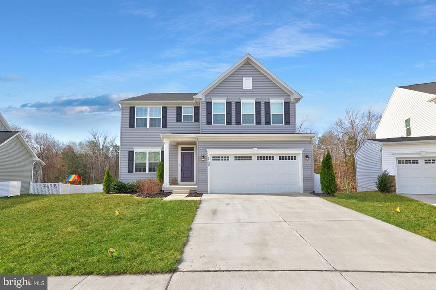 ***OPEN HOUSE SATURDAY, MARCH 28TH, 1-3 PM.*** VA Assumption Loan available to eligible Veterans with a 3.875% interest rate! Welcome home to this beautiful 4-year-old Colonial with nearly 3,800 finished square feet, nestled on one of the larger lots in the Lee’s Parke community. Backing up to peaceful woods for added privacy and scenic views, you'll love being outside as much as being in. The sun-filled main level features wide plank flooring and an open, inviting layout perfect for everyday living and entertaining. The gourmet kitchen is a standout with quartz countertops, stainless steel appliances, a gas cooktop, wall oven, a large island, and a walk-in pantry. Step out on the deck  for grilling and  enjoy the convenience of the deck steps to the backyard patio. The spacious family room overlooks the tree-lined backyard, while the versatile front room makes a perfect playroom or sitting area. An office tucked away at the back of the home provides an ideal work-from-home space. Upstairs you’ll find four generously sized bedrooms, including the spacious primary suite and a princess suite with its own private bath.  Enjoy the roman shower with two shower heads, one on each side, in the primary bathroom. Looking for more room? The fully finished walk-out basement offers a huge recreation room, a full bathroom, and additional storage space. Step outside onto the stamped concrete patio with built-in firepit and enjoy the fully fenced backyard, which offers plenty of space for outdoor entertaining, play, and relaxation. The home's solar panels will help reduce your energy costs over time. Lee's Parke has miles of walking trails, a community pool and clubhouse with a fitness area, tennis courts, and playgrounds. It's just a few minutes drive to Publix, Target, and other shops and restaurants. And it's just a short drive to the Spotsylvania VRE and I95. Don't miss this opportunity so call for your tour today!