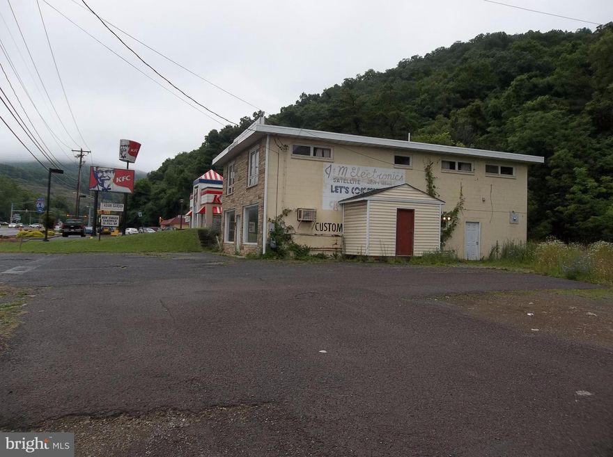 HARD TO FIND COMMERCIAL LOCATION IN PRIME AREA OF LAVALE - EASY ON - EASY OFF - I-68 - 1.95 +/- ACRES WITH 174' OFF ROAD FRONTAGE - 3,840 SQ FT BUILDING - HIGH VISIBILITY  - ZONED COMMERCIAL "B" BUILDING NEEDS WORK BUT RE-HAB POTENTIAL - PRIME - PRIME - PRIME LOCATION