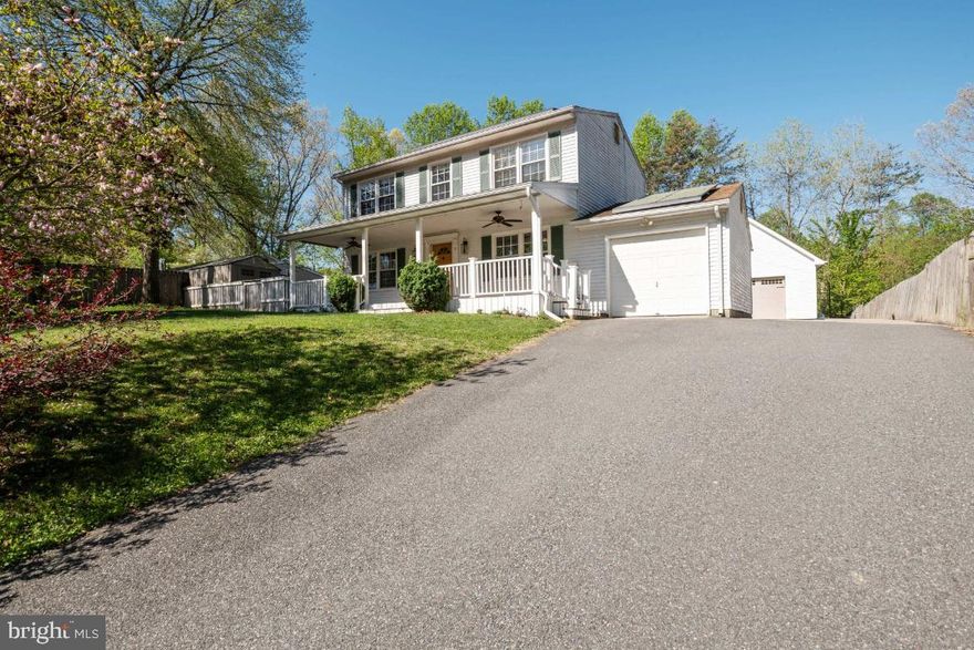 Location! Location! Location! Located minutes from the VRE, I-95 and downtown Fredericksburg, sits the home of entertaining dreams! With 3 bedrooms, and 2.5 baths, this spacious colonial is the perfect size! As you enter the home from the huge front porch and well landscaped lawn, you are greeted by two separate living spaces. One leads to the attached garage with a separate laundry room and utility sink, and the other leads you to the primary living room with access to the kitchen. In the kitchen you will find a large amount of storage space with built-ins, access to the main level half bath, a storage closet and plenty of room to add barstools to the elevated butcher block counter top area. The kitchen overlooks a large, airy additional living space with high ceilings and wrap around windows. Upstairs you will find 2 spacious bedrooms with a full bathroom that holds a spa tub along with the welcoming primary and attached full bathroom! This property has extensive features from well established landscaping, to multiple patio areas, decks and a pergola perfect for hosting your next get together. Did I mention that it also has a large 2 car detached garage/workshop that also has a carpeted loft upstairs perfect for a home office?! This home has too many amazing features to mention! A must see today! Additionally, a new solar system has recently been installed.