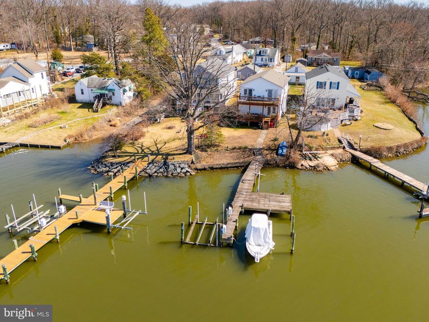 .Waterfront living meets everyday comfort at 1510 Denton Road.
Direct waterfront views off the porch with a 100 foot pier and 50 feet of water frontage. 
Currently set up as 2 apartments. Dividing wall can be removed to access upstairs
Exterior highlights include a private pier with boat lift, an oversized garage,
This is a level lot with a fenced back yard and close to local amenities.
Flood insurance not required.
Community boat slip located just next door.
AS IS