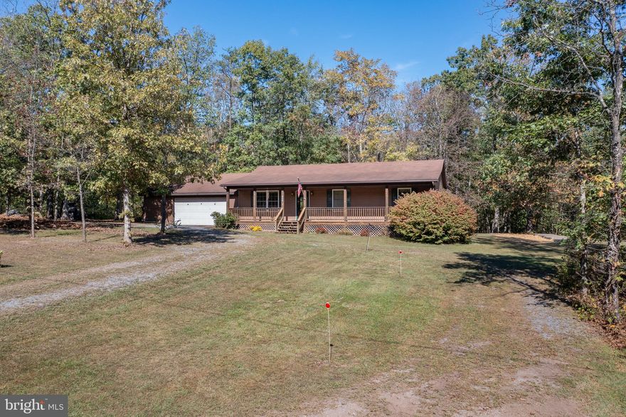 Don't miss out on this one level ranch nestled on 5 wooded acres, not far from town.   This well cared for home offers an open & bright floor plan with 3 bedrooms, 2 full baths, large living room that flows into dining room,  and the kitchen which has newer appliances. Come relax and enjoy the peace & quiet from the rear deck or the full front porch.  Oversized 2 car garage ......lots to offer.