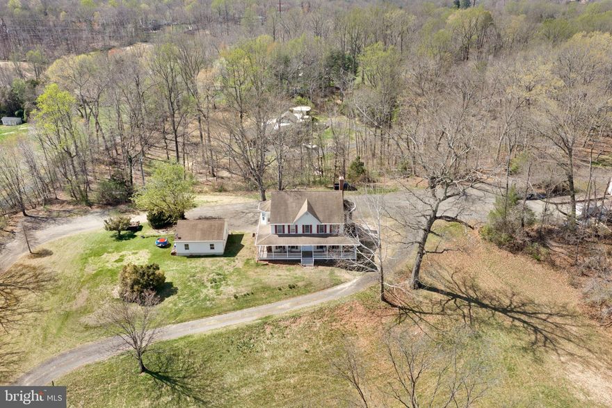Available for the first time in nearly 70 years, this exceptional 9.4-acre property offers a rare combination of space, privacy, and true walkability to historic Clifton. With road frontage on both Clifton Road and Dell Avenue, the property uniquely allows for a direct walk into town via Dell Avenue from the rear of the parcel — a rare and highly desirable feature for acreage of this size.

Positioned at the top of a gentle rise, the home overlooks a sweeping open field, creating a setting that feels private, peaceful, and timeless. The level homesite provides excellent usability, while the surrounding land offers flexibility and freedom that are increasingly hard to find. Built in 1997, the residence offers approximately 6,000 finished square feet across three levels with 9-foot ceilings throughout, featuring 5 bedrooms, 4 full baths, and 2 half baths, along with an upper-level office ideal for working from home or a quiet retreat.

The lower level adds versatility with three finished rooms, a spacious common area, and an additional full and half bath—perfect for guests, office space, gym, or hobbies.

Step outside and the lifestyle truly comes to life — room to spread out across your own land, gather around firepits, enjoy quiet evenings under the stars, and watch wildlife move through the open fields. Despite the private setting, you are just minutes on foot to the heart of Clifton: approximately a 6.5-minute walk to Clifton Park, 7 minutes to Peterson’s Ice Cream Depot, 7.5 minutes to Main Street Pub, 7.5 minutes to Trattoria Villagio, and 10 minutes to Trummer’s.

The property also includes an oversized detached 2-car garage and a substantial 30' x 60' steel outbuilding with electrical service and potential for future water connection, offering endless possibilities for storage, workshop space, or future use.

Properties like this are rarely available — combining nearly 10 acres, privacy, dual road frontage, and true walkability to town — a truly special opportunity to own a piece of Clifton that may not come around again for generations.