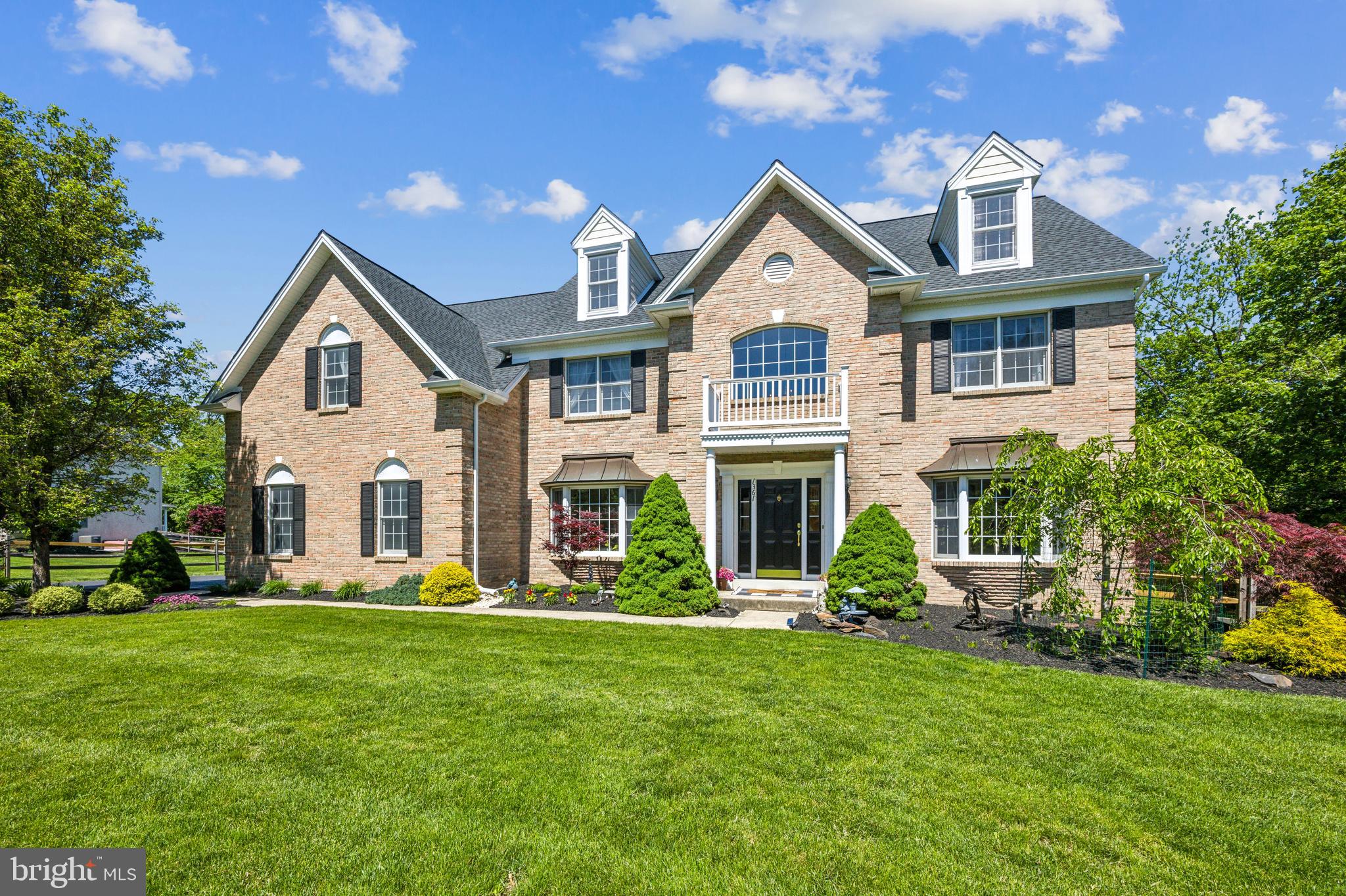 Welcome to this beautiful Colonial in The Estates at Glen Acres—professionally landscaped and meticulously maintained, showcasing pride of ownership throughout.
Set on nearly a full acre (.92 acres), this elegant yet functional home combines timeless style with modern updates and essential upgrades, offering lasting comfort and peace of mind.
Step into the grand two-story foyer, where a dramatic circular oak staircase and hardwood flooring set the tone for a spacious interior. Nine-foot ceilings, an oversized foyer window, recessed lighting, crown molding, and abundant natural light create a warm, open feel. A private first-floor office is perfect for remote work and easily adaptable as a bedroom, library, or playroom.
The open-concept kitchen features a dine-in island, separate breakfast nook, ample cabinetry, gas cooking with a brand-new double oven, and a large pantry. A nearby laundry room and direct access to the three-car garage add convenience.
At the heart of the home, the soaring two-story family room is filled with natural light from a wall of floor-to-ceiling windows. Custom built-ins, a gas fireplace, and a wet bar make it an ideal space for relaxing or entertaining. Sliding doors open to a spacious three-tier deck and EP Henry paver patio, overlooking a fully fenced backyard and peaceful, picturesque views—your private retreat in every season.
A secondary staircase from the family room leads to the second floor, where the serene primary suite awaits. Enjoy a vaulted ceiling, sitting room, two walk-in closets, and a spa-like bath with a platform soaking tub, glass-enclosed shower, dual vanities, and a dedicated makeup area. Three additional bedrooms include one with a private en-suite and two connected by a Jack-and-Jill bath, offering both privacy and convenience.
A newer dual-zone HVAC system ensures year-round energy-efficient comfort throughout the home.
The finished basement adds exceptional versatility, featuring high ceilings, crown molding, and built-in display shelving. It includes a private room with an attached full bath, a second bonus room currently used as a home office, and a game room wired for surround sound with a gas fireplace, wet bar, and dedicated fitness area. Most high-quality equipment is included—making it ready for move-in workouts from day one.
With thoughtful updates, no HOA fees, and generous living space inside and out, this home offers exceptional comfort, value, and room to grow—all in a friendly, active neighborhood where greeting your neighbor on your daily walk is commonplace. Close to parks, walking trails, shopping, and an easy drive to route 309 and 202, the PA Tpk, allowing access points North, South, East and West with an easy drive to Phila., NYC and all the surrounding communities. Schedule your private tour today and experience it for yourself.