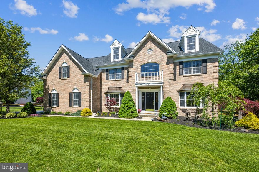 Welcome to this beautiful Colonial in The Estates at Glen Acres—professionally landscaped and meticulously maintained, showcasing pride of ownership throughout.
Set on nearly a full acre (.92 acres), this elegant yet functional home combines timeless style with modern updates and essential upgrades, offering lasting comfort and peace of mind.
Step into the grand two-story foyer, where a dramatic circular oak staircase and hardwood flooring set the tone for a spacious interior. Nine-foot ceilings, an oversized foyer window, recessed lighting, crown molding, and abundant natural light create a warm, open feel. A private first-floor office is perfect for remote work and easily adaptable as a bedroom, library, or playroom.
The open-concept kitchen features a dine-in island, separate breakfast nook, ample cabinetry, gas cooking with a brand-new double oven, and a large pantry. A nearby laundry room and direct access to the three-car garage add convenience.
At the heart of the home, the soaring two-story family room is filled with natural light from a wall of floor-to-ceiling windows. Custom built-ins, a gas fireplace, and a wet bar make it an ideal space for relaxing or entertaining. Sliding doors open to a spacious three-tier deck and EP Henry paver patio, overlooking a fully fenced backyard and peaceful, picturesque views—your private retreat in every season.
A secondary staircase from the family room leads to the second floor, where the serene primary suite awaits. Enjoy a vaulted ceiling, sitting room, two walk-in closets, and a spa-like bath with a platform soaking tub, glass-enclosed shower, dual vanities, and a dedicated makeup area. Three additional bedrooms include one with a private en-suite and two connected by a Jack-and-Jill bath, offering both privacy and convenience.
A newer dual-zone HVAC system ensures year-round energy-efficient comfort throughout the home.
The finished basement adds exceptional versatility, featuring high ceilings, crown molding, and built-in display shelving. It includes a private room with an attached full bath, a second bonus room currently used as a home office, and a game room wired for surround sound with a gas fireplace, wet bar, and dedicated fitness area. Most high-quality equipment is included—making it ready for move-in workouts from day one.
With thoughtful updates, no HOA fees, and generous living space inside and out, this home offers exceptional comfort, value, and room to grow—all in a friendly, active neighborhood where greeting your neighbor on your daily walk is commonplace.   Close to parks, walking trails, shopping, and an easy drive to route 309 and 202, the PA Tpk, allowing access points North, South, East and West with an easy drive to Phila., NYC and all the surrounding communities. Schedule your private tour today and experience it for yourself.