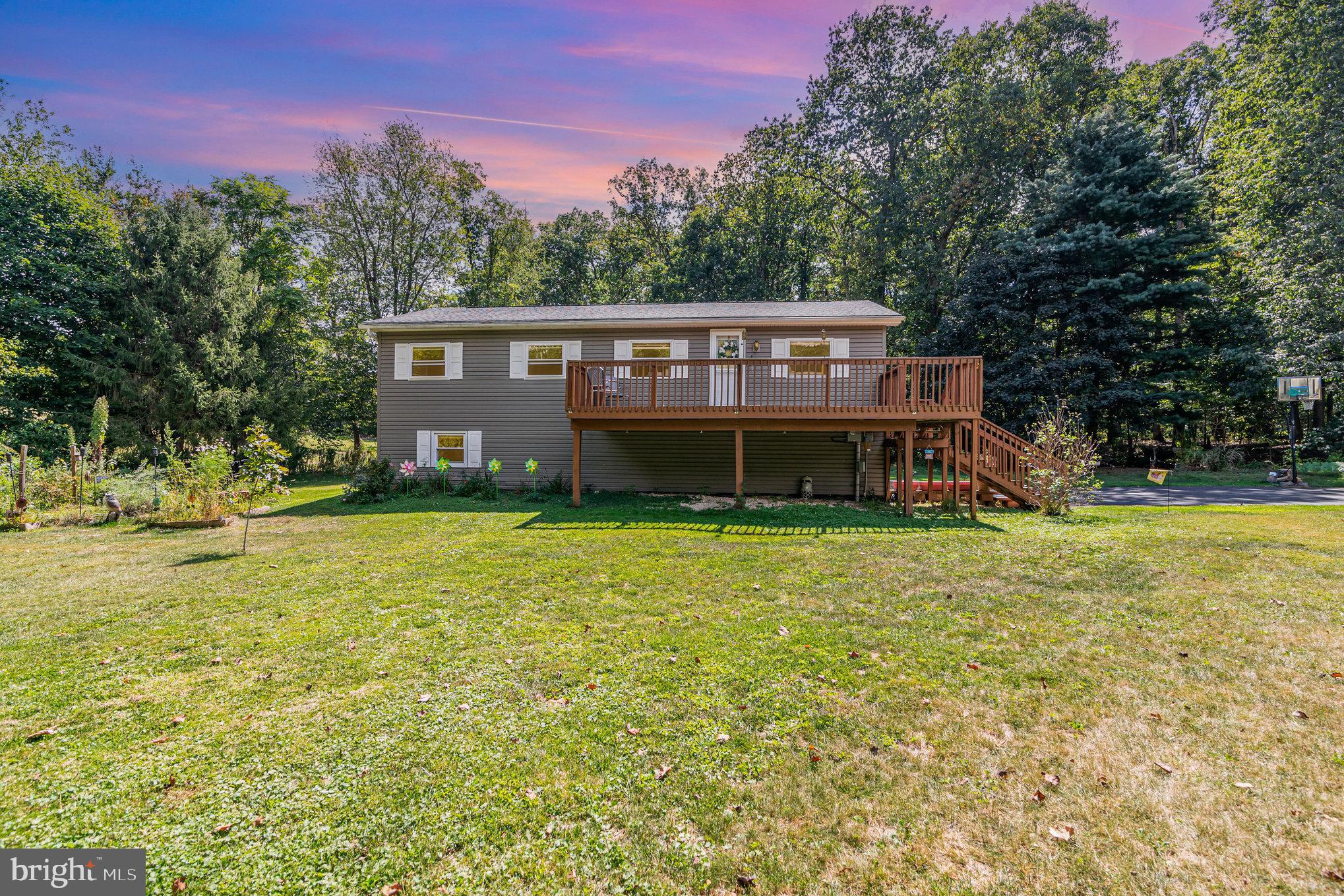Step into comfort and charm on 529 Mountain Road, where peaceful Boiling Springs living meets thoughtful design and endless possibilities!his 3-bedroom, 2-bath home features handicap-accessible bathrooms, a bright landing at the top of the stairs with water heater access, and a finished office space right at the bottom. The finished basement with a bar is perfect for entertaining friends and family. Outside, a quaint bridge over the creek leads to the neighbors, grapevines add charm, and the spacious deck is ideal for relaxing or hosting gatherings. Modern comforts include a whole-house water filtration system with UV light and softener, a whole-house generator, oil heat upstairs, and a propane stove downstairs. Enjoy serene privacy while staying close to the heart of Boiling Springs. Don’t wait, schedule your showing today and see why 529 Mountain Road is a must-see!