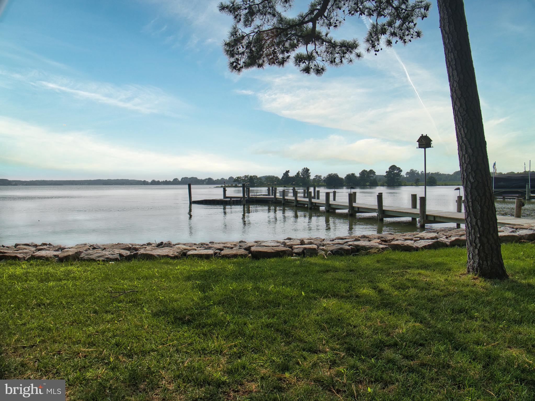 Welcome to your new waterfront home! Nestled on over 2 acres of prime waterfront on Shipping Creek. This property offers so much. Mature landscaping with sprinkler system to keep your lawn and landscaping lush. Beautifully appointed home with gourmet kitchen with open floor plan make this a prime area for entertaining. Did I mention the double-sided fireplace in the living/ dining area, with a wet bar that offers a wine fridge and icemaker. The primary suite offers a gorgeous primary bath with walk in shower and soaking tub with endless views of the creek. The primary suite also has huge walk-in closet and private screened in porch to take in your morning coffee. Two additional bedrooms offer a shared bath and separate entrances and their own screened in porch! Not enough room in the main house? Take the breezeway from the main house to the heated and cooled 3 car garage, then wander up the stairs to the private deck and enjoy more views of the creek. Located over the 3-car garage are separate guest quarters with a full gourmet kitchen, open floor plan, full bath and bedroom. With so many great features to this property how could there be more? How about over 200 ft of waterfrontage fully rip-rapped, pier with water, electric and ride on boat and jet ski lifts. Don't blink and miss this one in sought after Goose Point Estates.