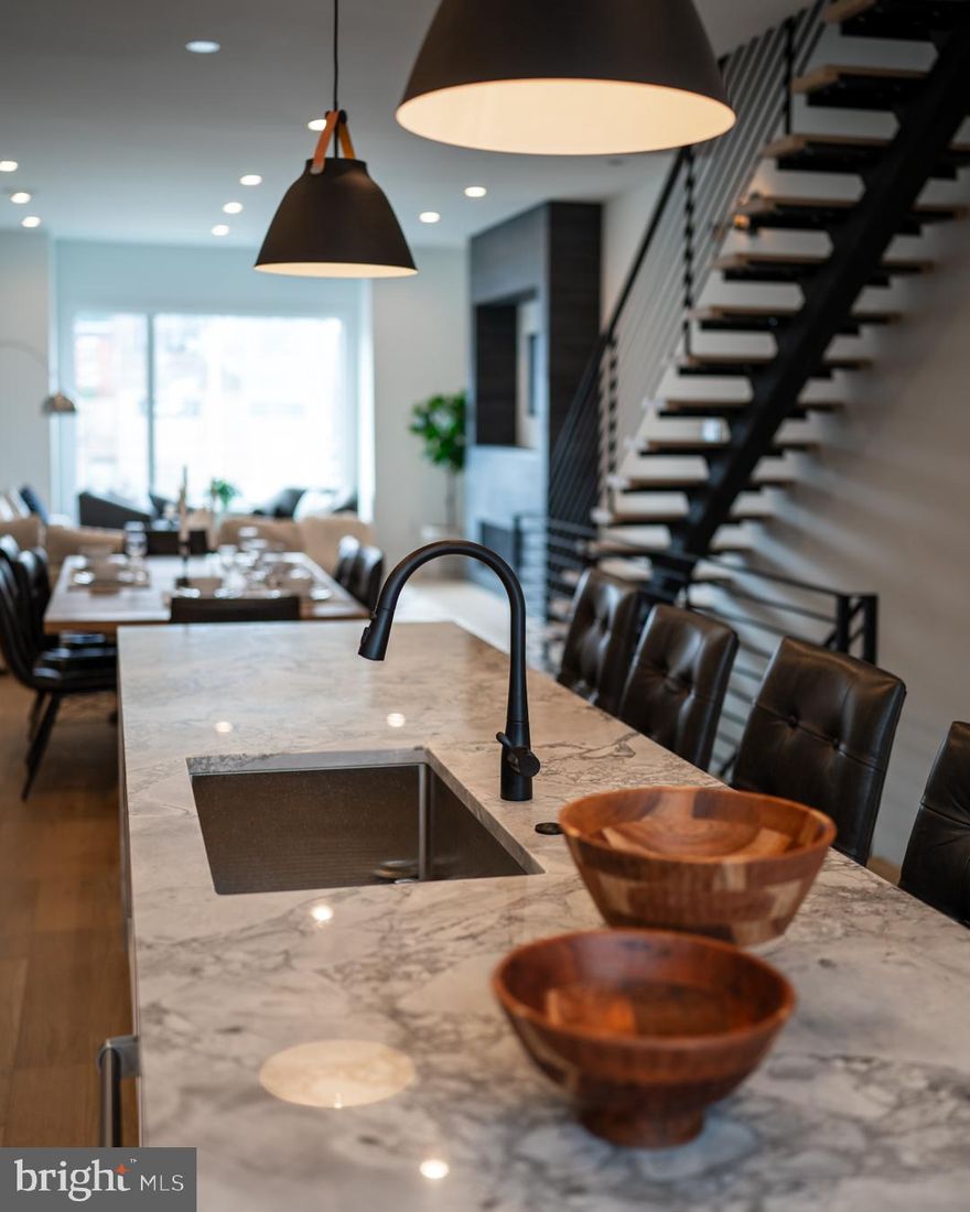 Luxury Living at Lydian Place offers the quintessential city lifestyle. These ten exquisitely designed townhomes on the Avenue of the Arts create a unique urban experience to enjoy the rich cultural life of Center City Philadelphia.  With over 4,000 square feet of living space across 5 levels, each home features 4 spacious bedrooms, 4 full baths, and 2 half bathrooms, with a masterfully designed pilothouse, 2 decks, and a personal elevator! Step up from the light-filled foyer and atrium to the expansive open concept main level. Enjoy the comfortable living room with high ceilings, modern flooring throughout, and an ample dining area that flows into the gourmet chef kitchen. Luxurious yet functional, the kitchen features custom quartz countertops, and backsplash, with appliances from Subzero, Thermador, Bosch, and Wolf. The third floor is comprised of two large bedrooms with en-suite bathrooms, walk-in closets, and a full-sized laundry room. The impressive owner's bedroom is a regal 600 sq. ft and is the ultimate sanctuary occupying the entire fourth floor. The primary bathroom features a freestanding soaking tub, an oversized shower room of seamless glass, a private lavatory, and double vanity. Special attention has been given to the rooftop with a masterfully designed layout highlighting a spacious 375 sq. ft pilothouse complete with a custom wet bar and convenient powder room nestled between the two separate decks. This optimal space for entertaining offers spectacular panoramic views of the Philadelphia skyline. More home enjoyment comes with the fully finished lower-level family room or media room and includes a bedroom/office/exercise room and full bathroom. Each home offers garage parking with tons of extra room for storage, a top-of-the-line security system with one year of free monitoring services, and a multi-zoned energy-efficient HVAC system. The audio system includes five pairs of in-ceiling speakers, one pair of outdoor speakers.  Smart wiring infrastructure is installed for ultimate convenience and future upgrade possibilities with dual data (Cat6) and cable in every bedroom. Walk Score - 97 Transit Score - 100 Bike Score - 88. Conveniently located near Target, Sprouts Market, Whole Foods, Pet Smart, & PA Wine & Spirit Shop. Some homes are currently being built. Taxes estimated, 10 YEAR TAX ABATEMENT, some finish choices may vary, some features shown may vary slightly, Specifications, details, and finishes are subject to change.