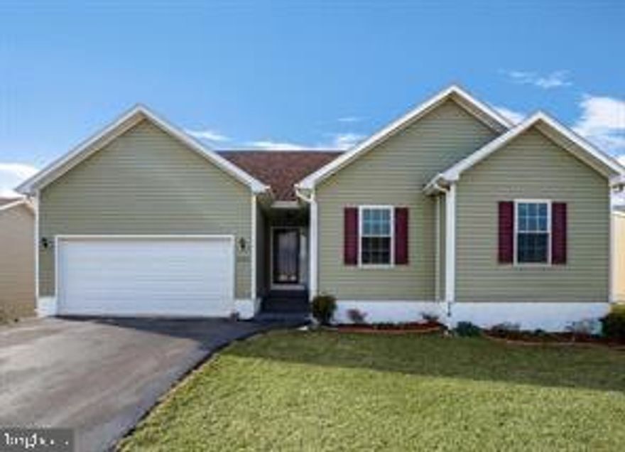 Enjoy one level living in “The Vineyards”.  This lovely well maintained 3 bedroom, 2 bath rancher has a wonderful open concept perfect for spending time with family and entertaining.  The kitchen with its warm and inviting blue cabinets has plenty of cabinet space, an island and granite counter tops. The main level laundry room & pantry sits between the kitchen and the 2 car garage.  The spacious family room has a lot of natural sunlight pouring in.  The primary suite has vaulted ceilings and an ensuite bath with double sink vanity, soaking tub and stand alone shower.  Two additional bedrooms and a full bathroom complete the main level.  The lower level walkout basement has been framed out and partially drywalled, recessed lighting installed and there is also a rough in for a 3rd full bathroom.  Fabulous backyard with both a deck & patio.  Conveniently located near I81 and Route 9 in Martinsburg.