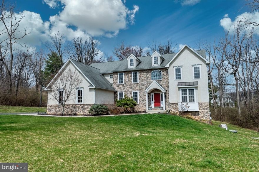 Welcome to this exceptional Colonial tucked away on a quiet cul-de-sac in the highly sought-after Owen J. Roberts School District. Built in 2006, situated on 1.55 acres, and beautifully maintained, this stunning home offers the perfect blend of elegance, space, and everyday comfort. From the moment you arrive, the striking stone exterior sets the tone for what’s inside. Step into over 3,800 square feet of thoughtfully-designed living space, where an open floor plan creates seamless flow for both entertaining and daily life. The heart of the home is the inviting Family Room, complete with a cozy wood-burning fireplace, and opening directly to the upgraded Kitchen—perfect for gathering with family and friends. The Kitchen is a true standout, featuring new granite countertops, a center island, spacious pantry, and high-end appliances - making it as functional as it is beautiful. The main level also includes a formal Living Room, a formal Dining Room with crown molding and chair rail, a generously-sized office space, a convenient Laundry Room, and a stylish Powder Room for guests. Ascend either staircase and retreat to the luxurious Primary Suite, offering a tranquil Bedroom, quiet sitting area, walk-in closet, additional double-wide closet, and a spa-inspired Bath with custom walk-in shower, double vanity, and built-ins. Three additional bedrooms provide exceptional space and flexibility, including: a shared bath for two bedrooms and a private guest suite with its own bedroom space, full bath & walk-in closet. The daylight, walk-out Lower Level offers endless potential—whether you envision a home gym, media room, or additional living space—complete with large windows that fill the space with natural light. Step outside and experience your own private retreat. Expansive decks and patios overlook the peaceful, tree-lined backyard—perfect for entertaining, relaxing, or enjoying nature year-round. Additional Highlights include: newer HVAC, whole-house generator, water conditioning system, 3-car side-entry garage, fresh paint in areas, refinished hardwood floors in Foyer & Kitchen areas, new carpeting in select areas and more! Enjoy the best of both worlds—peaceful living with convenient access to major routes for commuting. Outdoor enthusiasts will love the proximity to Pigeon Creek Nature Trail and the scenic Schuylkill River Trail. This is more than a home—it’s a lifestyle. Showings begin at the Open House on Saturday, 4/4 | 11 AM – 1 PM. Hop on by and experience it for yourself!