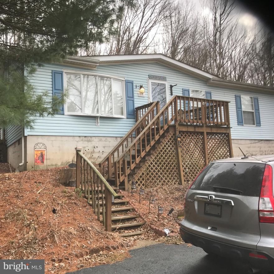 Adorable home in excellent location close to Ridge Rd, but up on the hill so has some privacy with a .5 ac lot. Nice living room, large eat in kitchen with brand new stove. 3 bedrooms (master has walk in closet). 3rd Bedroom has W/D in closet. Fridge, washer and dryer all stay. Newer (about 10 years) roof and new hot water heater. The perfect compact home for the right person(s). Estate sale.