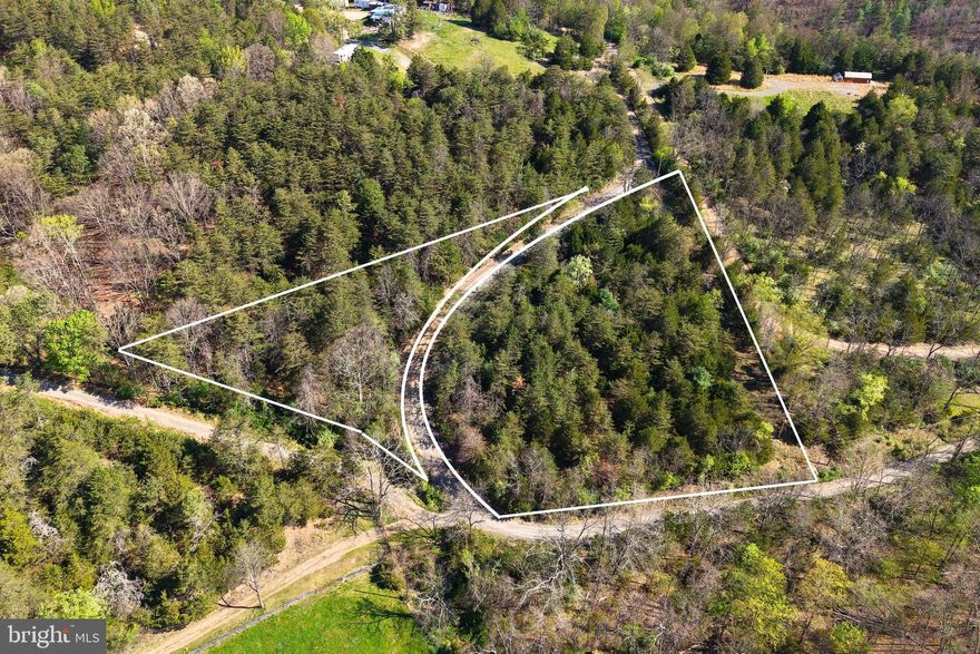 Seller Financing Available – Your peaceful getaway is closer than you think with easy financing.
Deep Run Hollow Road | Delray, WV | 2.65 Acres
An electric meter is already on-site and ready to go — a rare head start on this 2.65-acre wooded retreat in the quiet hills of Delray, West Virginia. A canopied gravel drive stretches approximately 1,167 feet along the road frontage, with a small stream winding along both sides and a natural build site near the road that works well with the existing terrain.
The property is entirely outside mapped flood zones with zero wetland coverage, and neighboring homes with established utilities nearby, with well and septic assumed. Whether you're envisioning a private residence, homestead, or recreational escape, this land is ready for it.
The forest is rich with mature conifers, abundant deer sign, and frequent wildlife sightings including rabbit and squirrel. The dense canopy, flowing stream, and natural cover create ideal habitat for game, offering you a private slice of West Virginia wilderness right on your own land.
All of this in a peaceful rural setting with no commercial nuisances nearby. Washington, DC is 2 hours east and Shenandoah National Park just 1 hour south.
Contact us today to set up a showing. Let's build your vision together!
