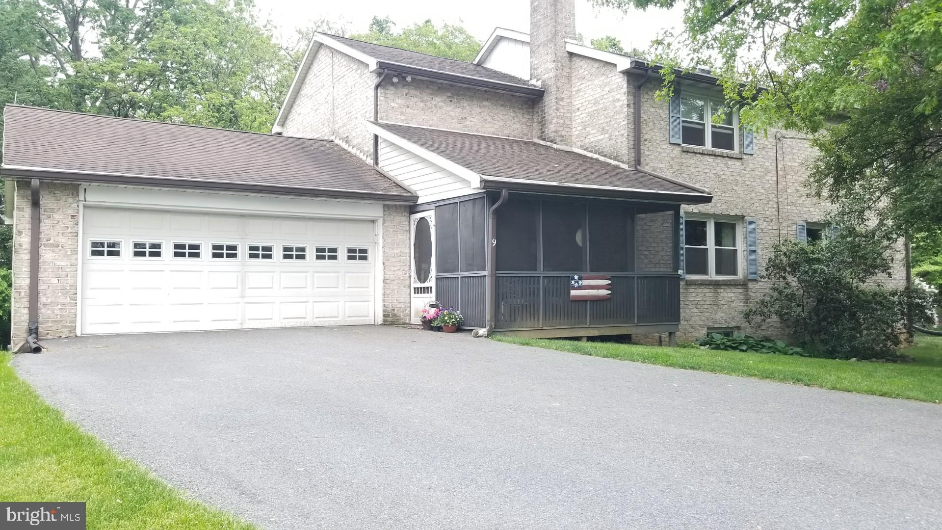 NEED SPACE for a large family, the in-laws, a business, or just room to stretch, we have it: A brick solid residence in a friendly neighborhood that will hold everybody and everything. Sitting on 4.06 acres, this property has an 11x7 attached Greenhouse, 20x23 attached garage and 14x13 screened in porch for entertaining. Need an in-law solution, inside you will find a lower level with kitchen, full bath and large family room with wood burning fireplace for those cold winter evenings. Lower level does have outside access. Main level has large kitchen with eat-in area as well as a separate formal dining room. Upon entering the living room located off of the front foyer you will find a pellet stove, another source of warmth on those cool evenings. A bonus room on the main level could be used for an office, playroom or hobby/craft room. Mud room/laundry/half bath with quarry tile on main level. Access the upper level via one of two staircases. This home has a beautiful wood paneled wall & railing staircase off the front foyer or a spiral staircase located in the kitchen. The upper level has 3BR, 2BA and a large cedar walk-in closet. On the upper level you will find an additional family room that was formerly a fourth bedroom. This home was previously a three unit and was converted back to a single family home by the current seller. Spiral staircase in main level kitchen could be removed if you would like to convert family room back to fourth bedroom. Upper level also has walk up attic access in what is currently the third bedroom. On the property is a 40x60 building with a 20x60 overhang and a storage shed that was used for the current owner's business. Two additional storage sheds behind the home. Home is currently listed as Land Use: 105 Mixed Residential/Commercial. Circular paved driveway for plenty of parking and additional parking at the 40x60 building below the home. MANY POSSIBILITIES ABOUND with this property. A spectacular residence that demands your attention! Seller's had new radon system installed May, 2025.