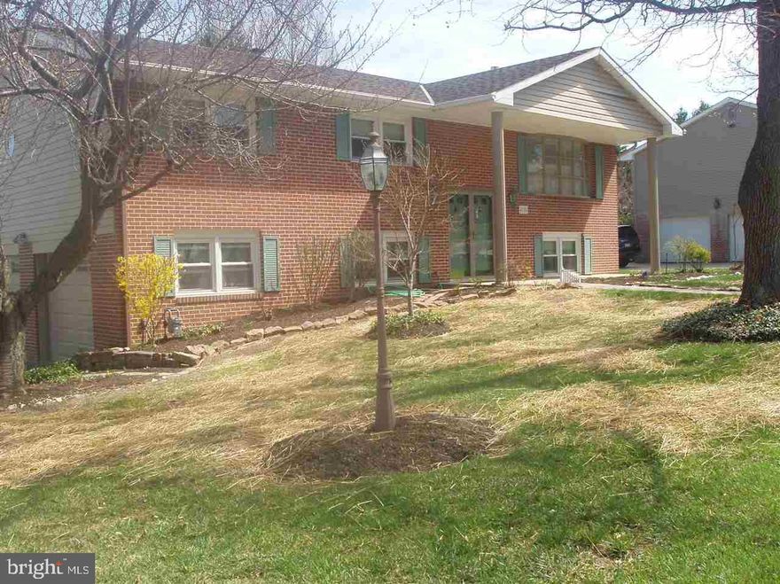 Lovely 3 bedroom, 2 bath split foyer on beautifully landscaped lot in Sherwood Forrest.  Freshly painted, cleaned, and move in ready.  Lower level family room with gas fireplace opens to lower patio and freshly painted deck above.