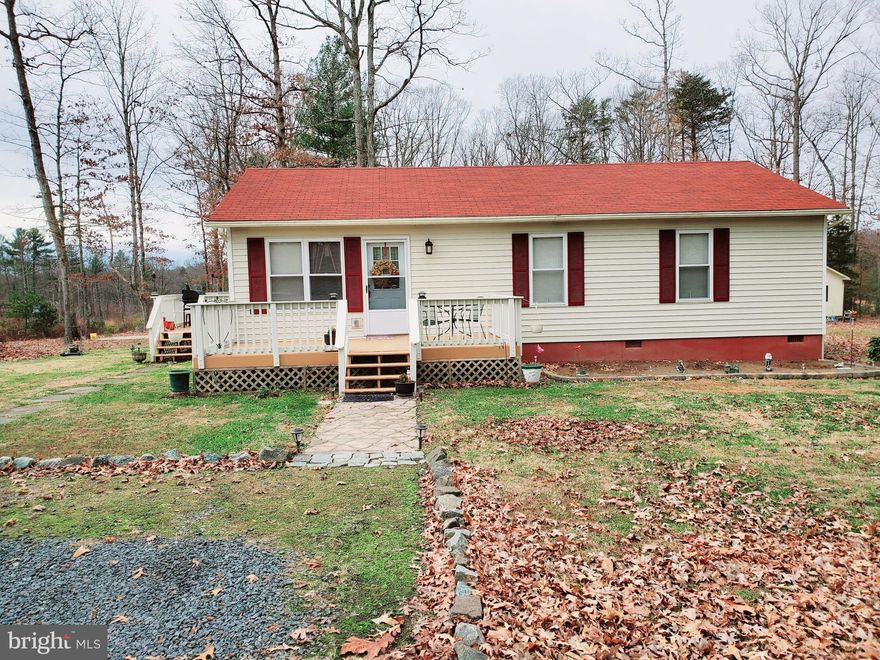 If privacy is what you're looking for then privacy is what you will get with this charming Rambler nestled in between mature hardwoods on 2.66 acres.  The property offers 3 bedrooms 1.5 baths with open concept, a front deck and a side deck. Plenty of room outside for out door entertaining. Utilize the two room shed as storage, She Shed or Man Cave. Grow your own veggies and herbs in the boxed in garden area. Endless opportunities with this property await you. Washer, Dryer and Freezer conveys with the property as well!