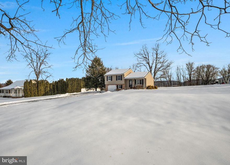 Incredible opportunity to own this turn key home in a phenomenal location.  Recent updates include a new roof (2024) and newer water heater(2024).  This 3 bedroom home sits on a a very private 1 acre lot with sweeping views out of every window.  The expansive garage offers plenty of space and storage or could be finished for quite a bit of extra square footage.  The inside has very durable luxury vynl plank flooring along with spacious rooms. The kitchen has plenty of counterspace and features stainless steel appliances and a large eat in area.  It also offers access to the large deck with sweeping mountain views and a large level yard.  Upstairs has 3 spacious bedrooms and a large full bath.  Do not miss this opportunity to own a phenomenal home in a even better location.