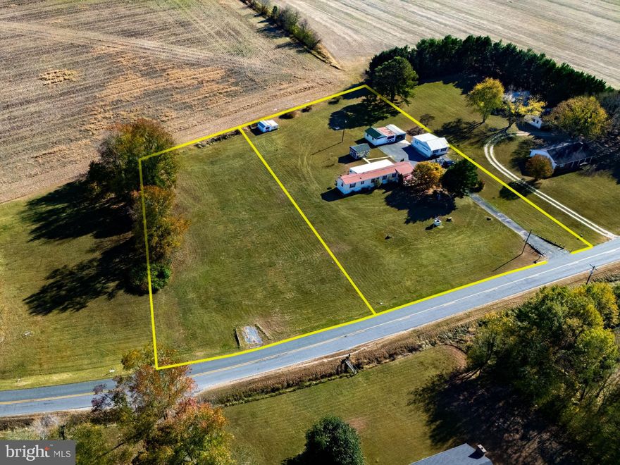 Discover the best of country living just minutes from the Choptank River with this well-maintained 3 bedroom, 1.5 bath home, set across 2 lots totaling 2.31+/- acres. From the spacious yard to the oversized single wide with a durable metal roof. Relax in the bright 3-season room, which offers serene views of surrounding farmland. The property features a paved driveway, a convenient parking area, and an impressive array of outbuildings, including 3 garages, a workshop, and a versatile boat/carport. Enjoy nearby river access for boating and fishing while enjoying the rural lifestyle. This property is a rare find for those seeking space, charm, and function—don’t miss out!
