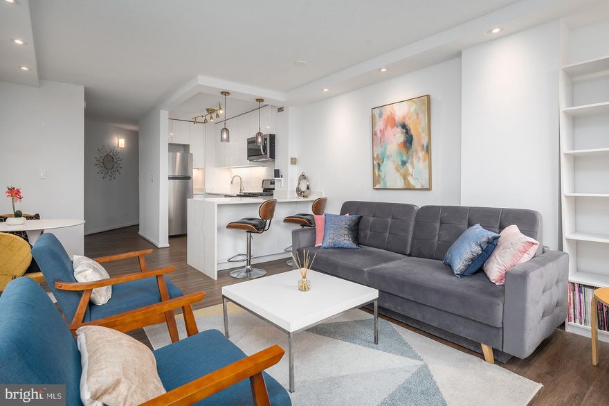 Welcome to unit 712 - stylishly renovated, slick and spacious unit of Riviera at Chevy Chase Condominium now available. This unit was fully renovated with solid hardwood floors, modern kitchen with bright lacquer kitchen cabinets and elegant calacatta quartz countertops, including a waterfall eat-in breakfast bar.  Cozy light filled living room features an ambient electric fireplace, perfect for lounging and relaxation.  Large en-suite offers sizable closets and a fully renovated bathroom with a walk in shower.

ALL UTILITIES INCLUDED! Additional amenities include a rooftop swimming pool,  fitness room, party room, 24-hour concierge. Only a few blocks from Bethesda's restaurants, shops and metro. Enjoy walking/jogging the nearby Crescent Trail.