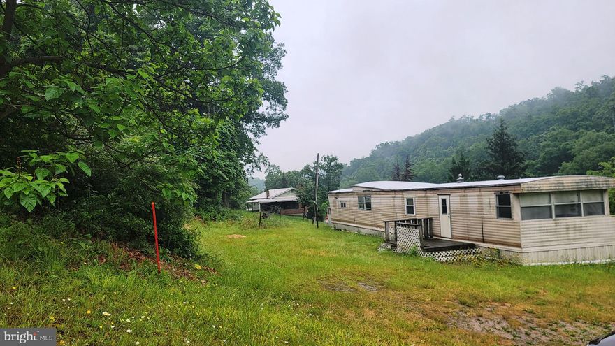 Lot is 1.78 acres. Owner purchased to extend their lot with all intentions of tearing the mobile home down and having it removed. Therefore they have no idea of the condition of it or if it could be restored to living use.